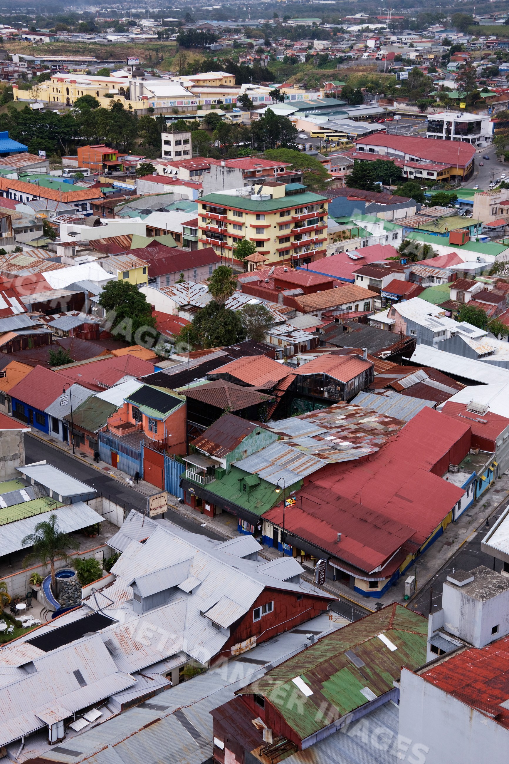 Aerial view of urban buildings and rooftops in a dense neighborhood