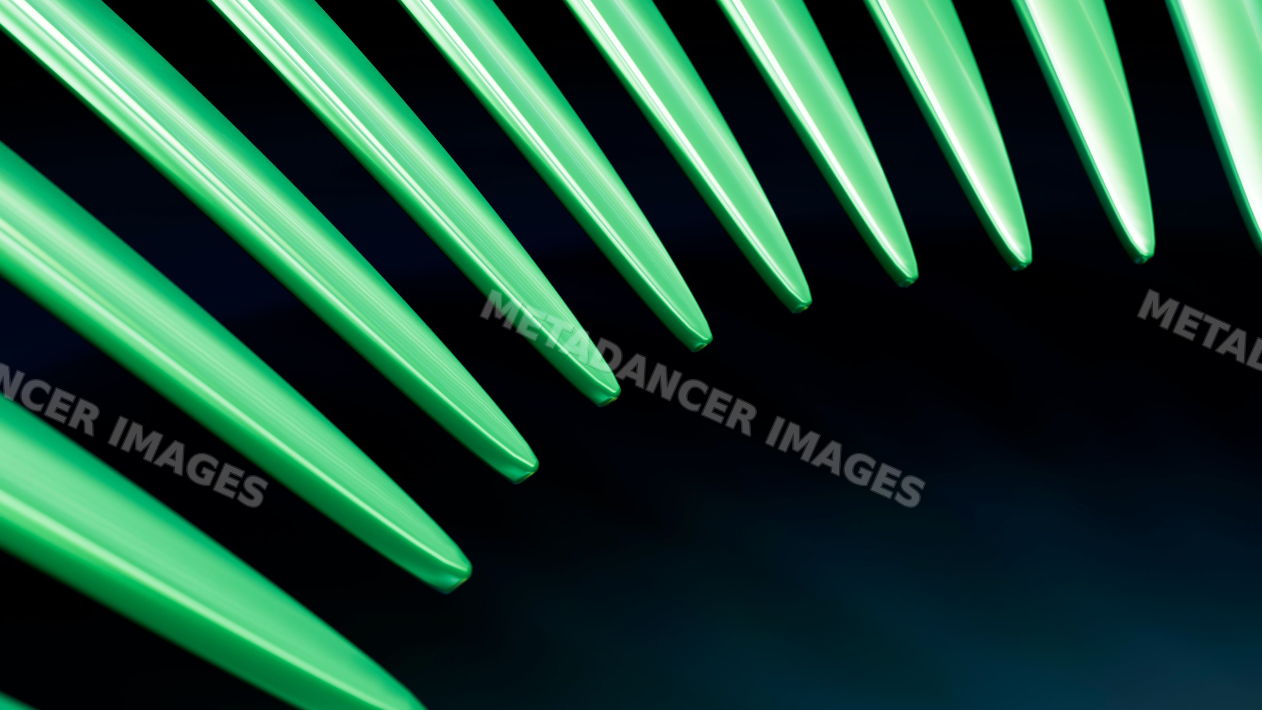 Close-up of green plastic forks on dark background