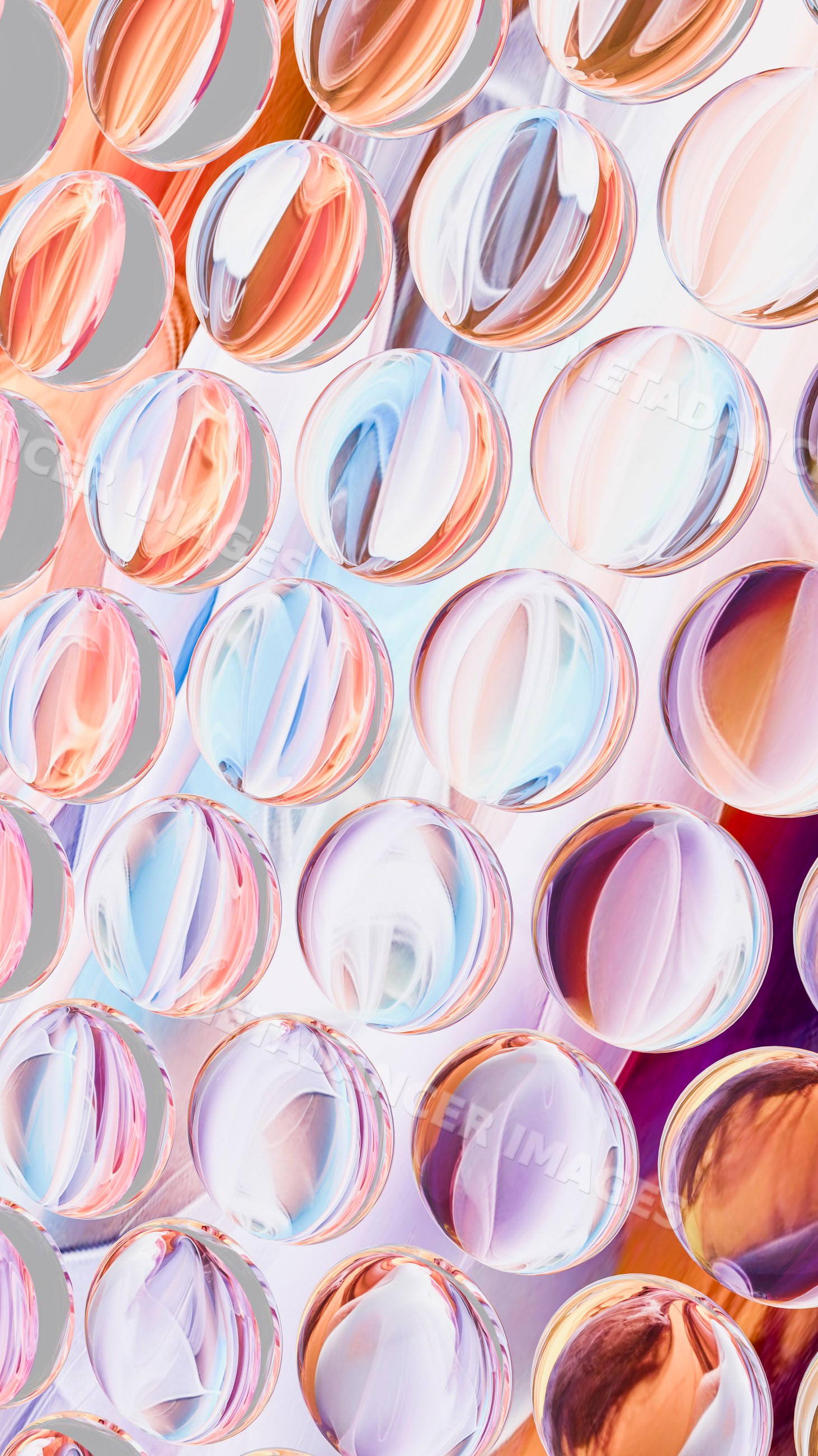 Colorful round glass marbles with abstract light reflections pattern