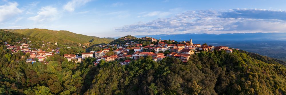 Town of Sighnaghi with the Caucasus Mountains