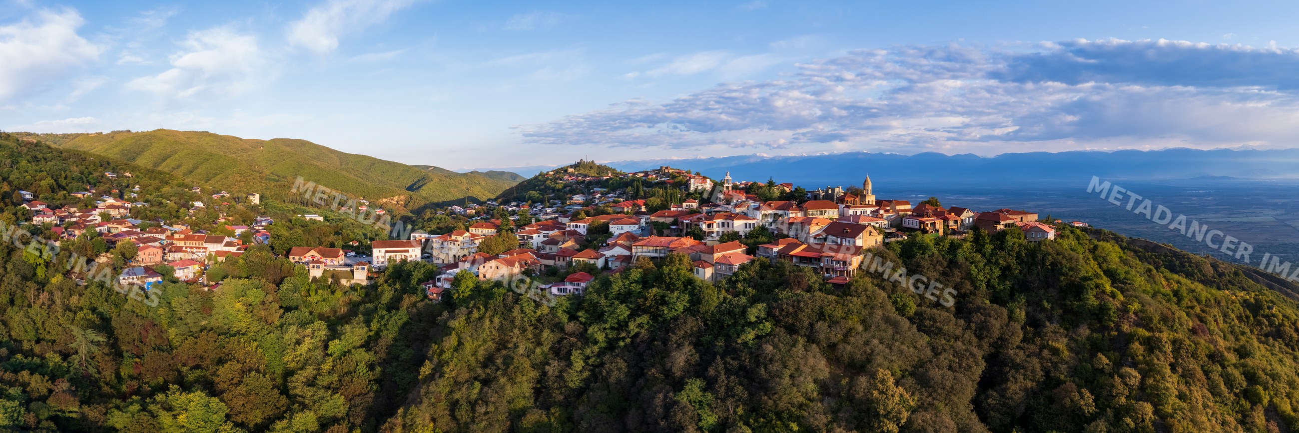 Town of Sighnaghi with the Caucasus Mountains