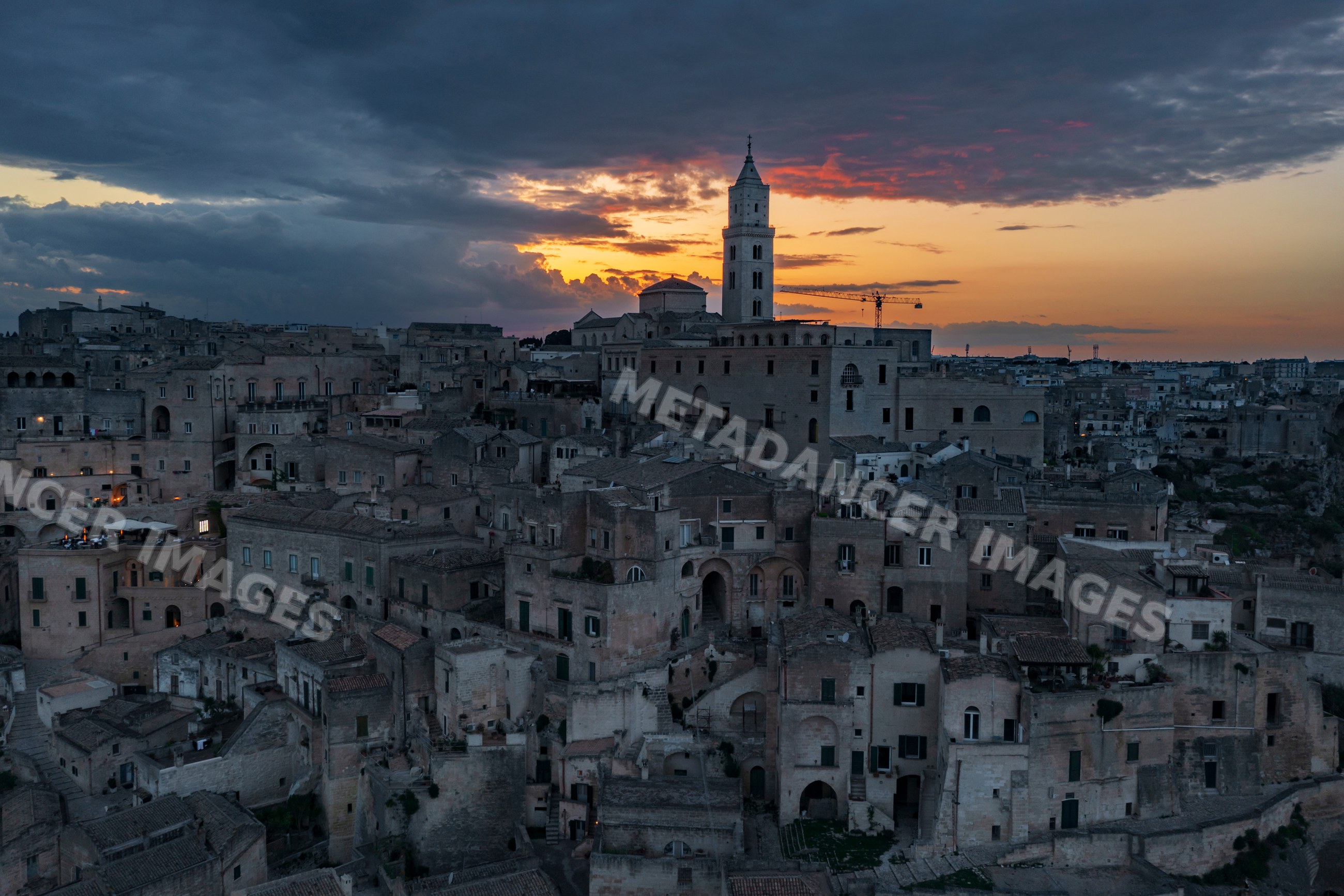 Sasso Caveoso in matera, Italy at Sunset with historic stone buildings