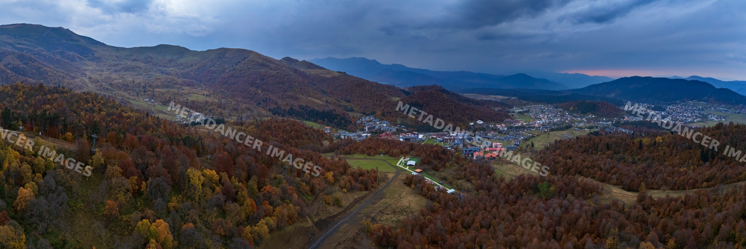 Panoramic mountain town view with autumn forest in bakuriani Georgia