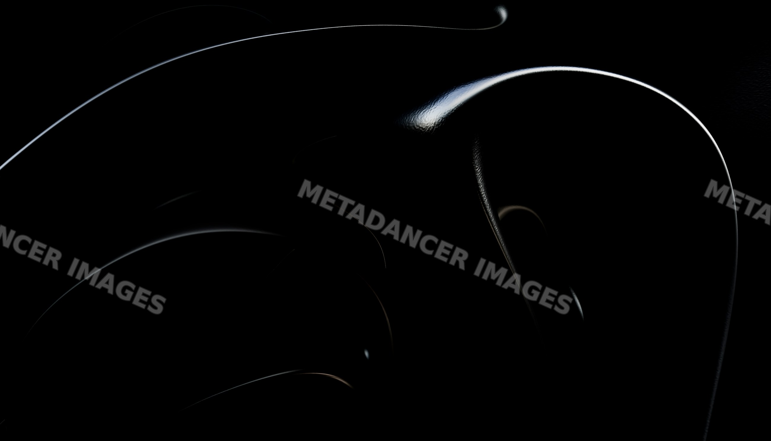 Close-up of a black abstract sculpture with glossy curved shapes