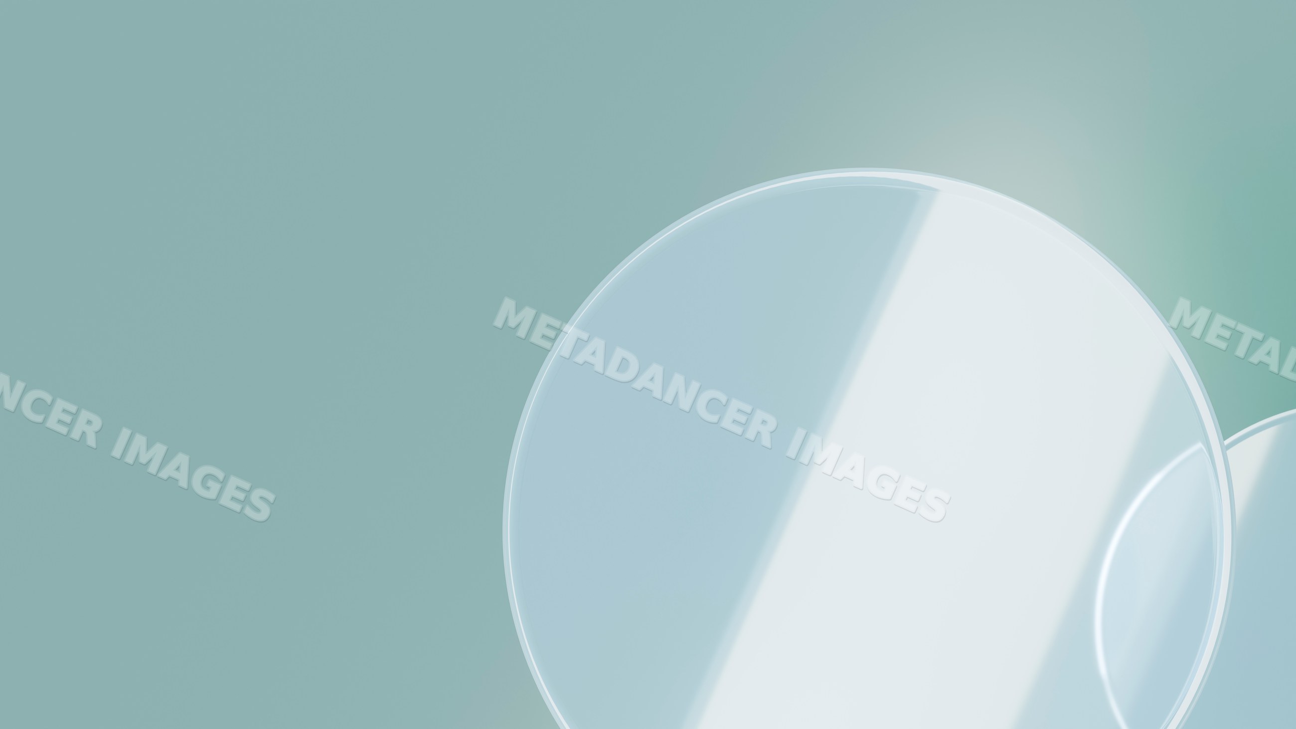Transparent glass circles reflecting light on blue-green background