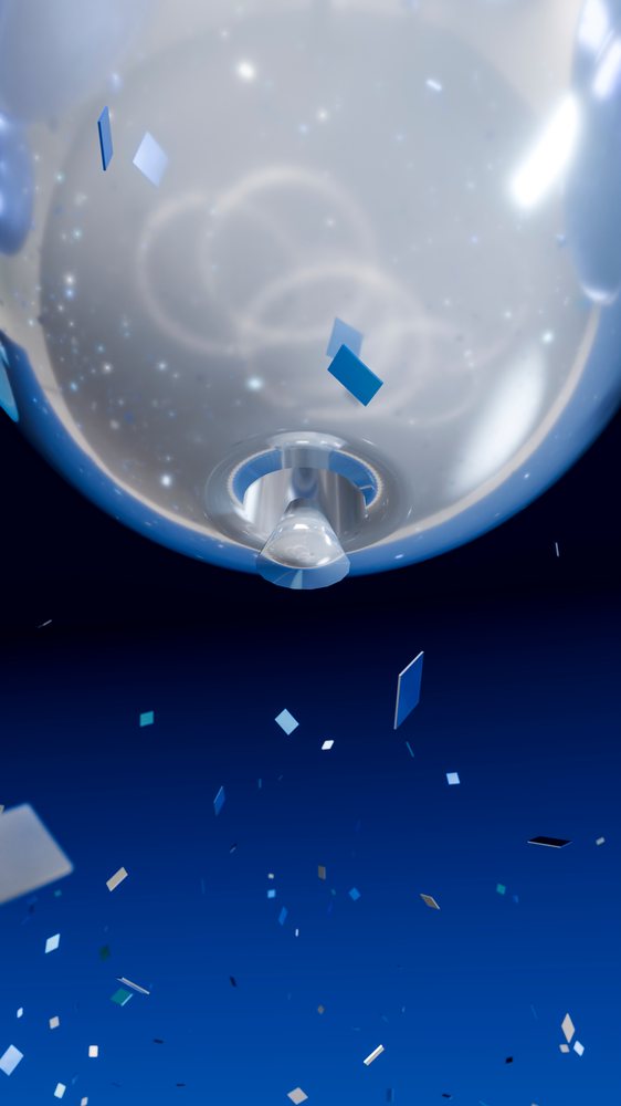 Festive balloon with colorful confetti against blue background