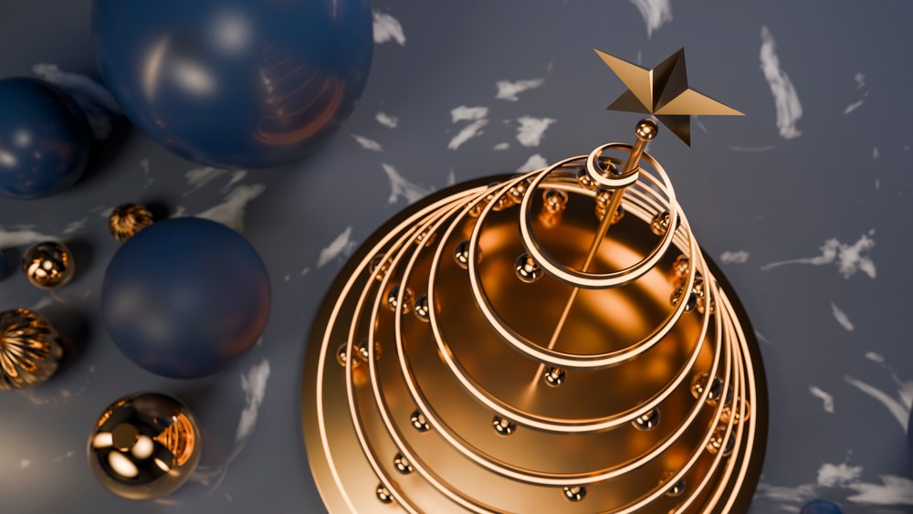 Gold modern christmas tree with star topper and metallic spheres
