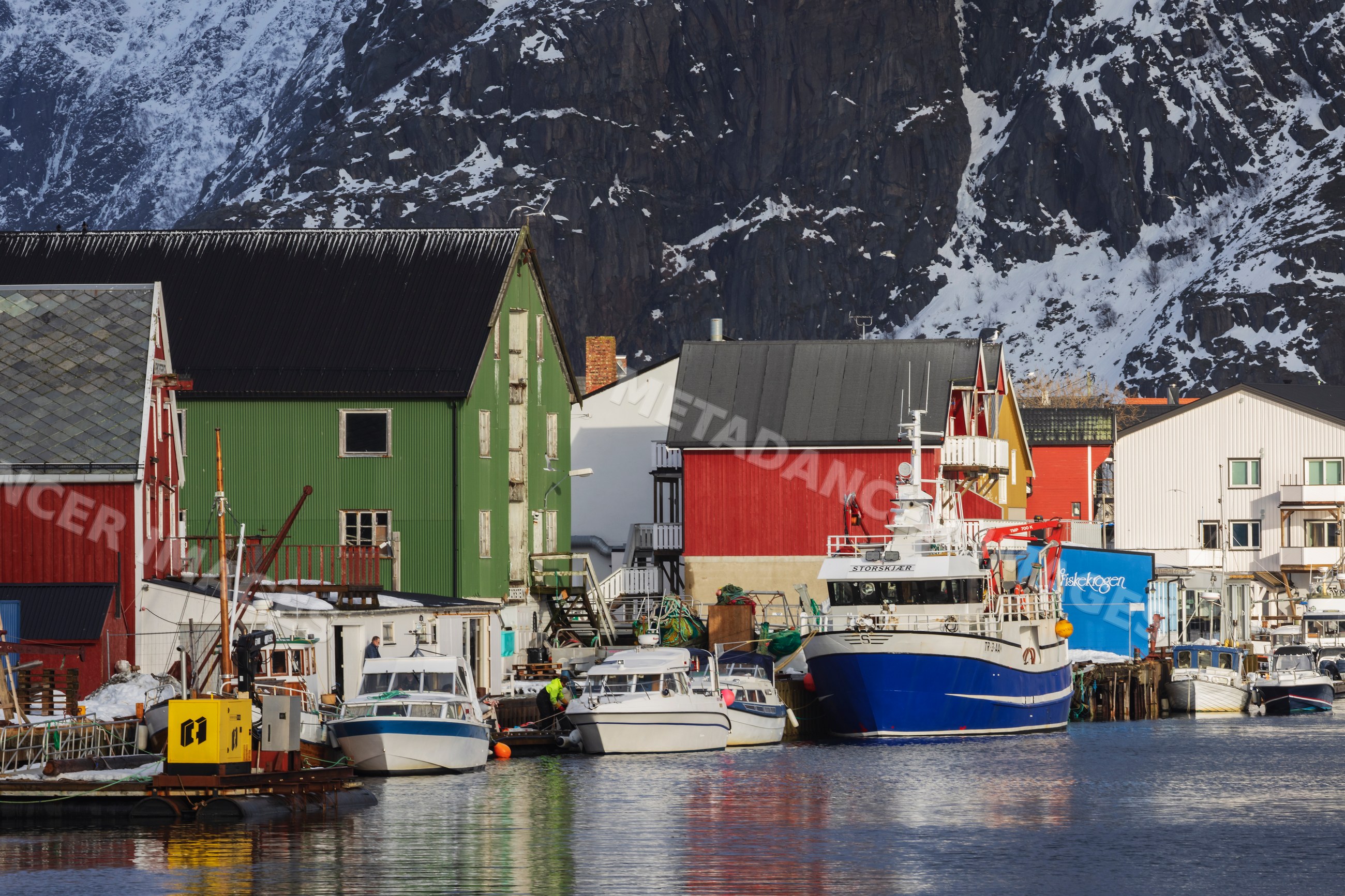 Fishing boats moored at port in Henningsvaer, Lofoten, Norway