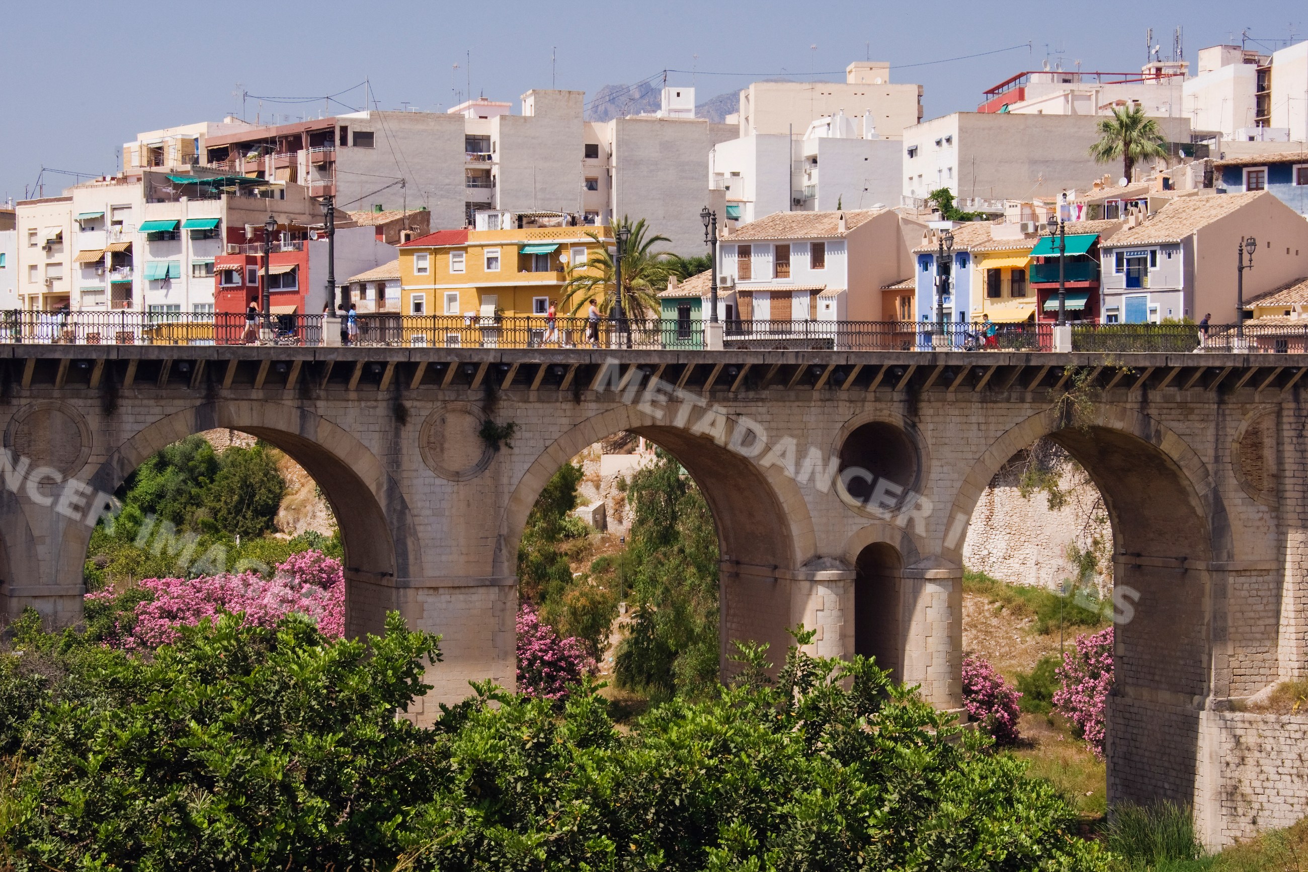 Bridge with colorful buildings and cityscape, Spain