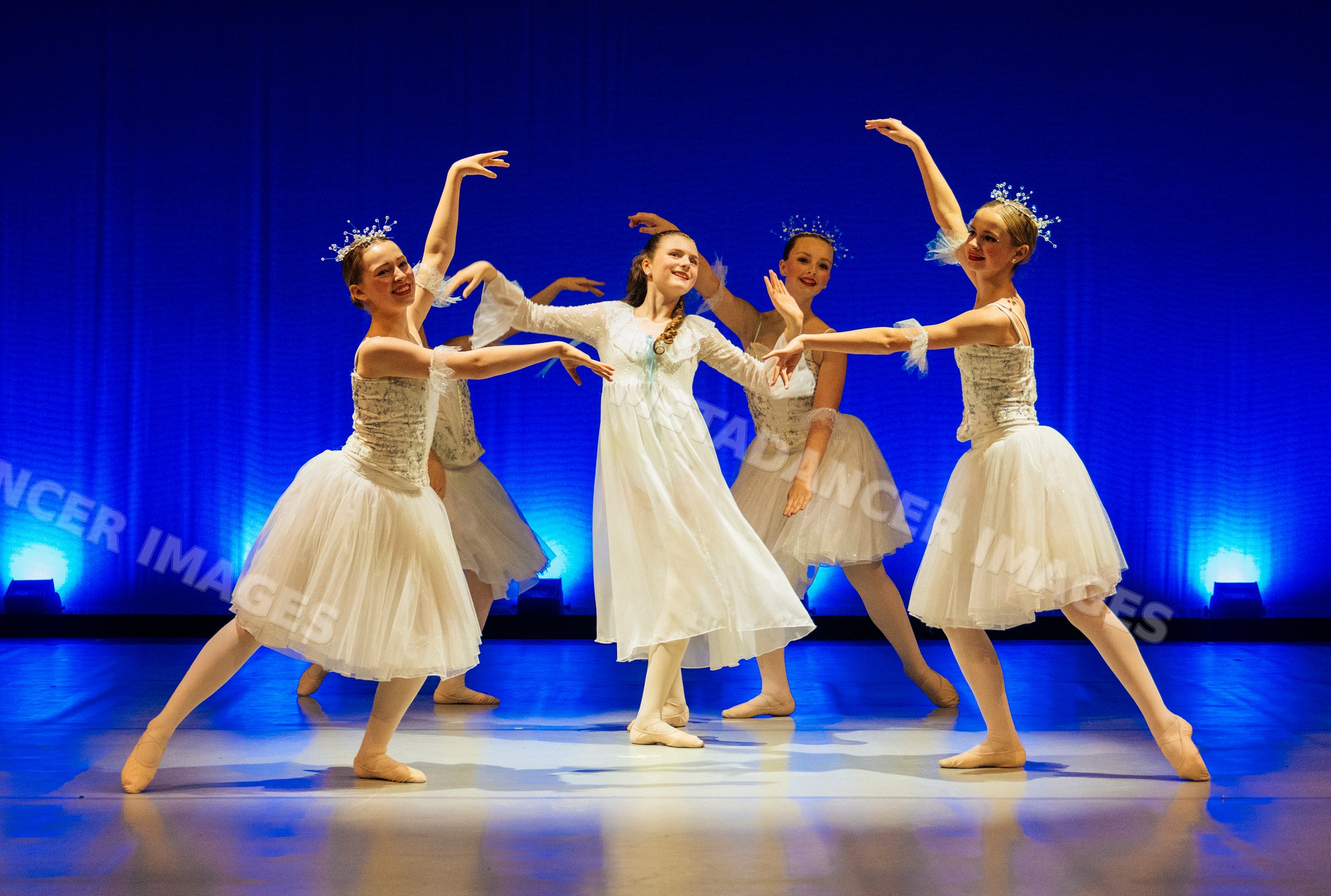 Young ballet dancers perform a classic dance on stage