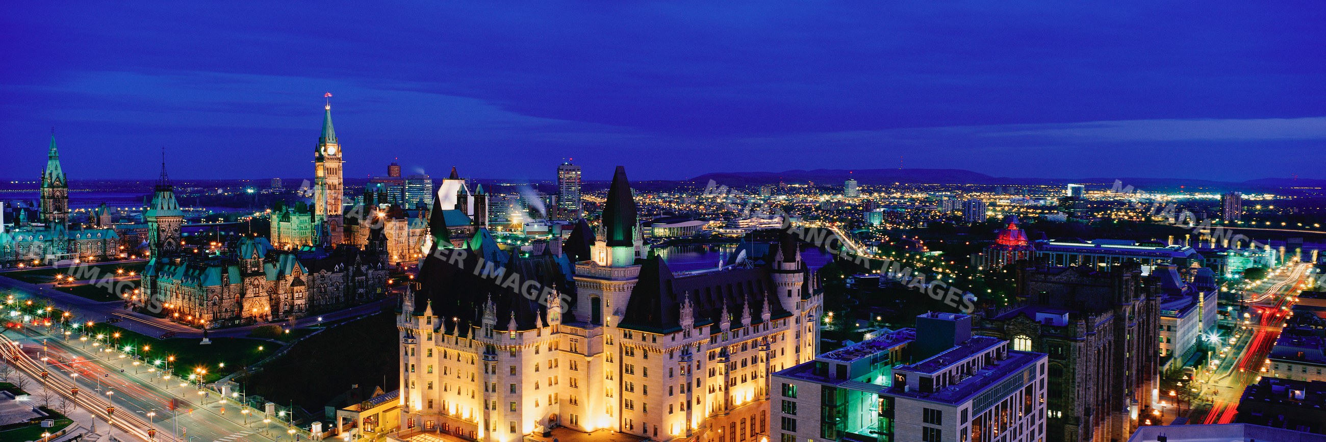Night panoramic view of ottawa cityscape with illuminated parliament