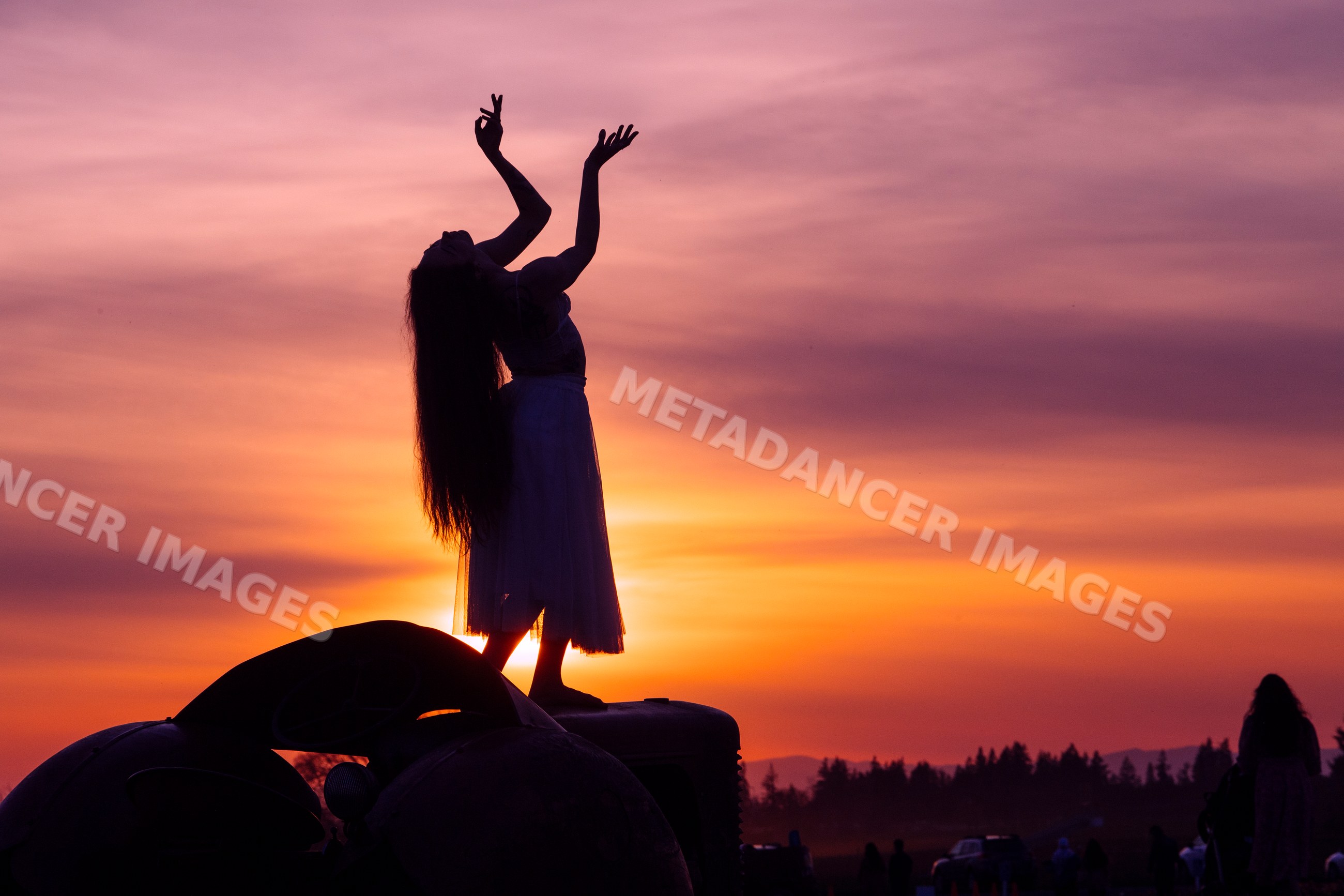 Silhouette of white dancer at sunset outdoors