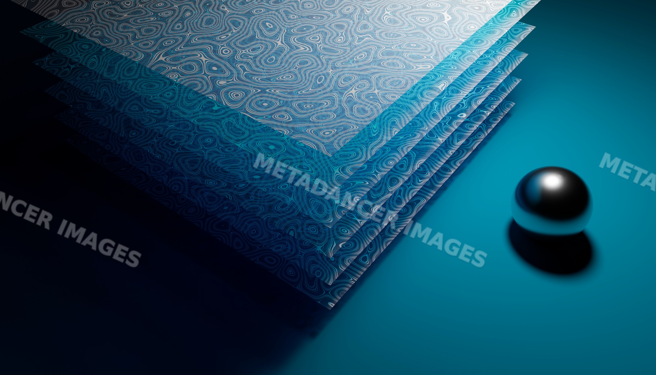 Stack of patterned papers with a metal reflective ball on blue surface