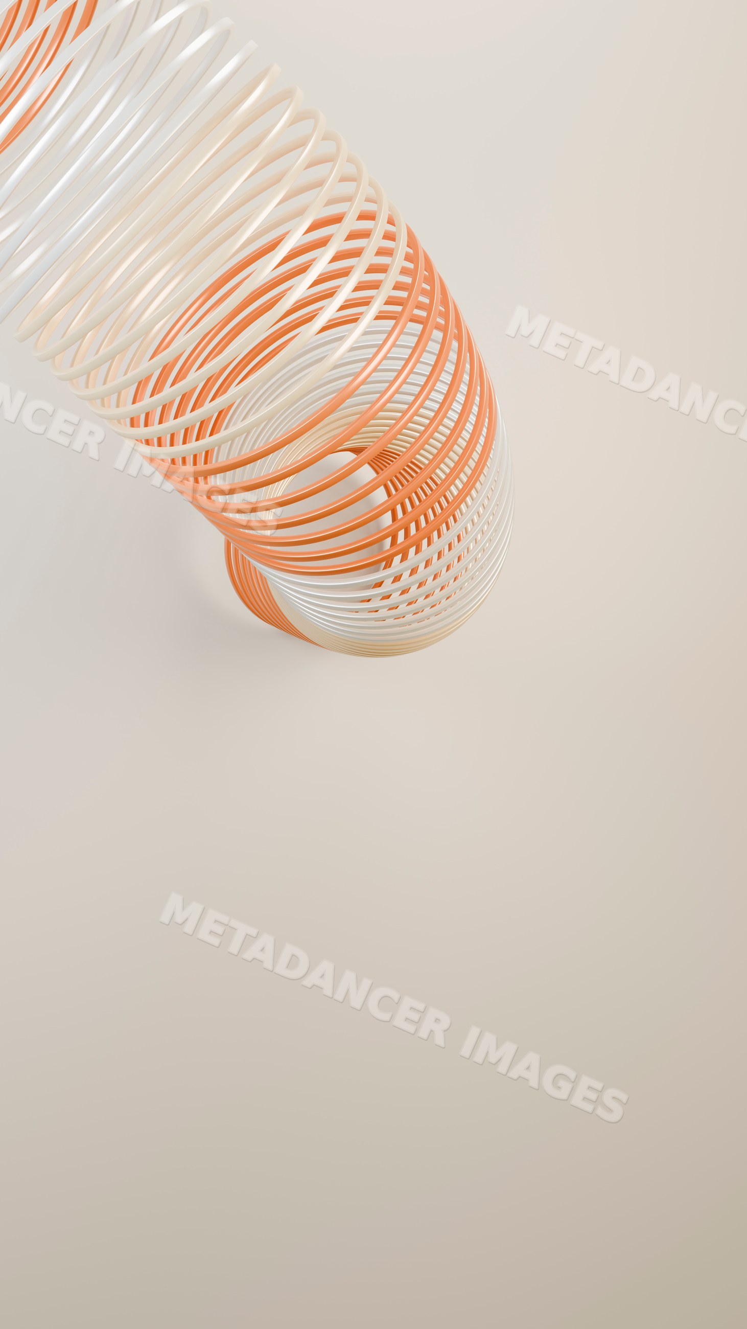 Slinky toy with orange and white coils from upward angle