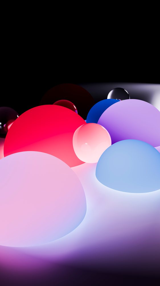 Colorful glowing 3d spheres clustered on reflective surface