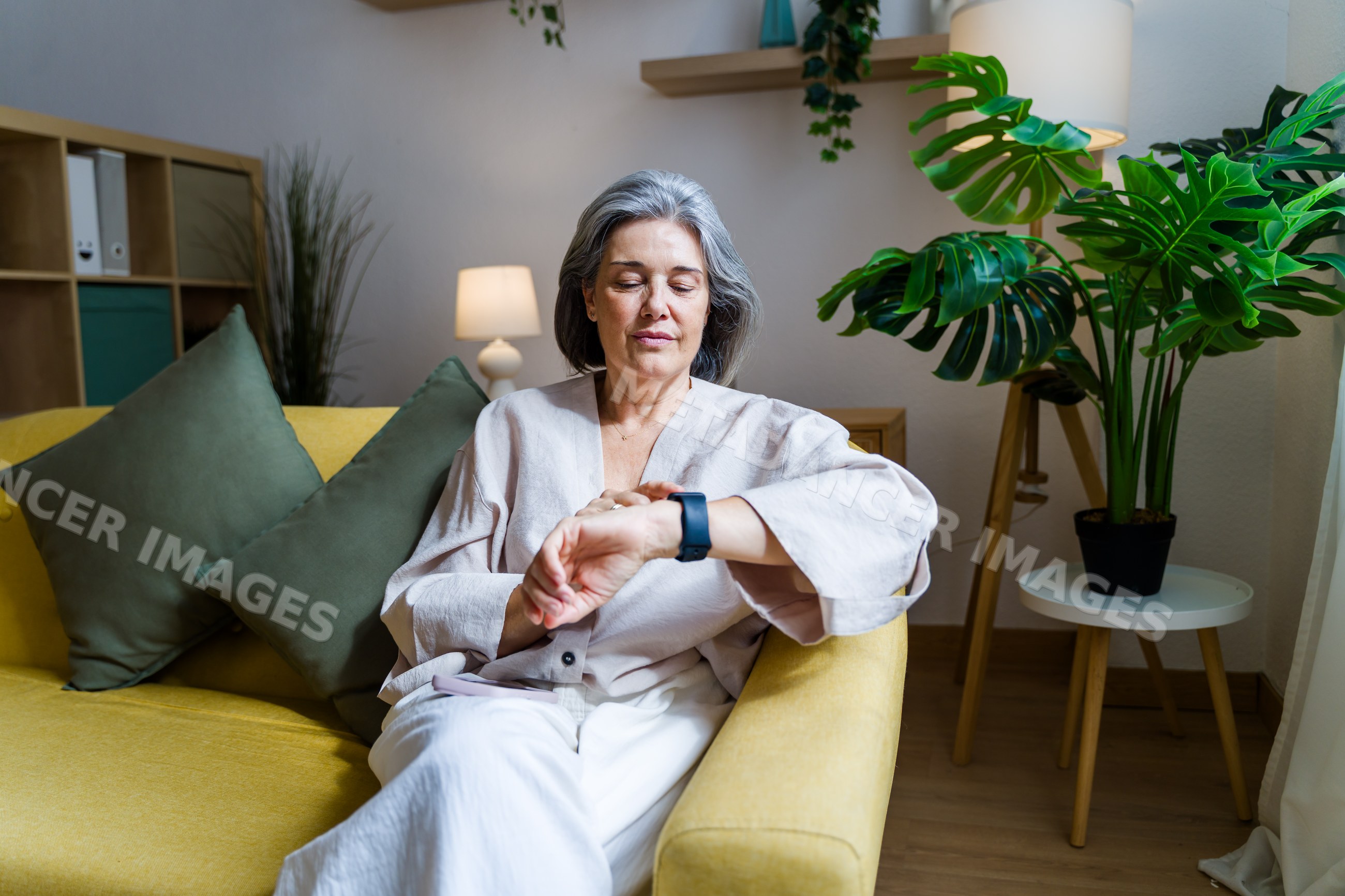 White woman checking smart watch
