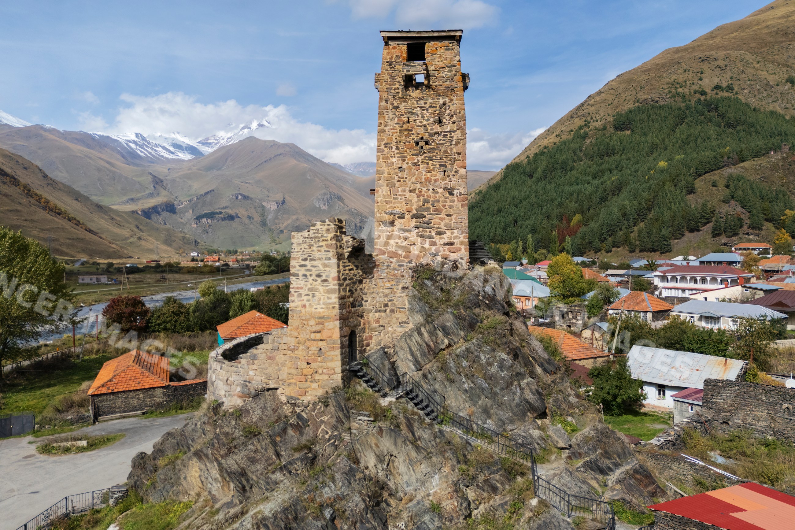 Ancient stone watchtower on rocky hill in Sno Village Georgia