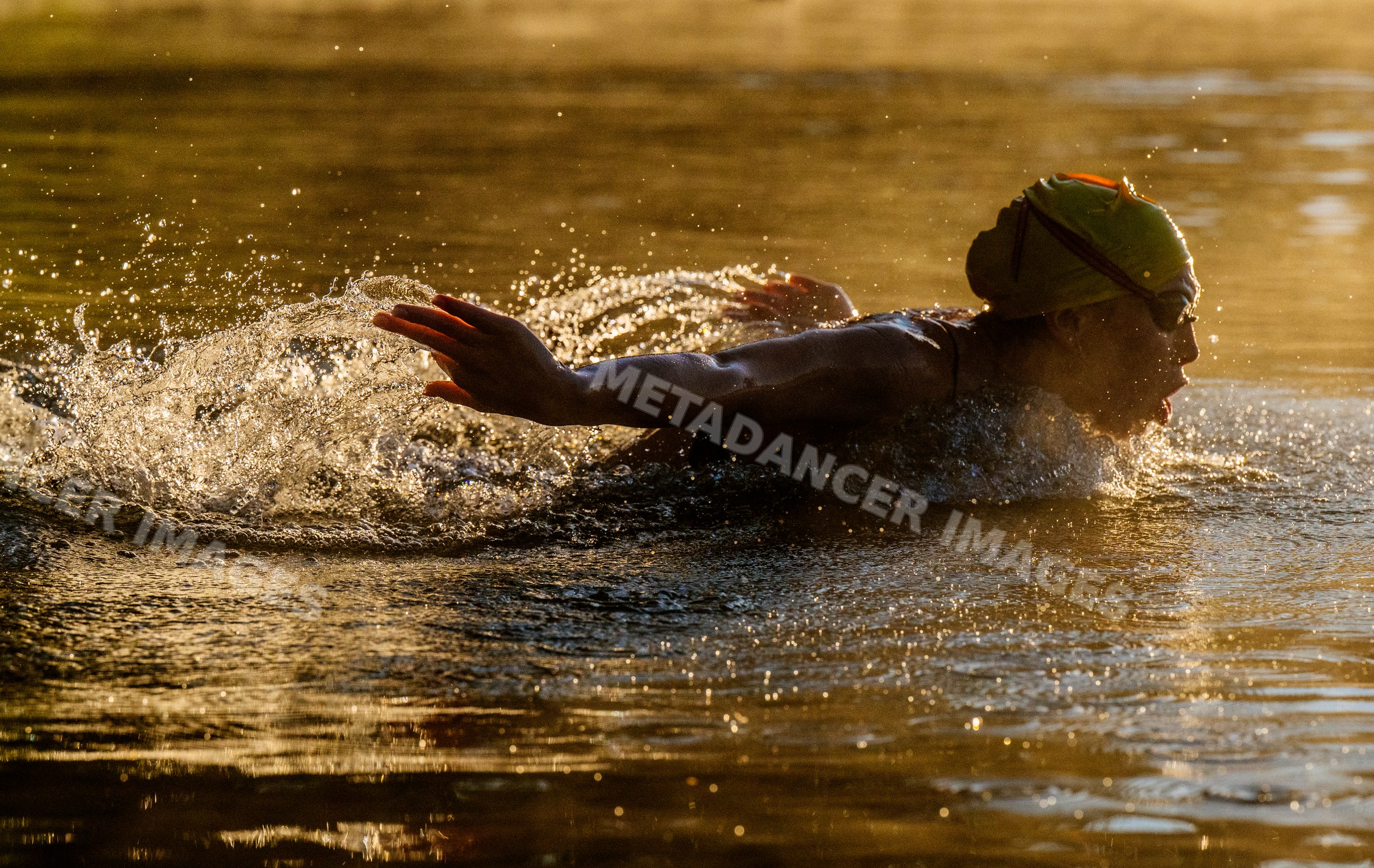 White athlete swimming butterfly stroke