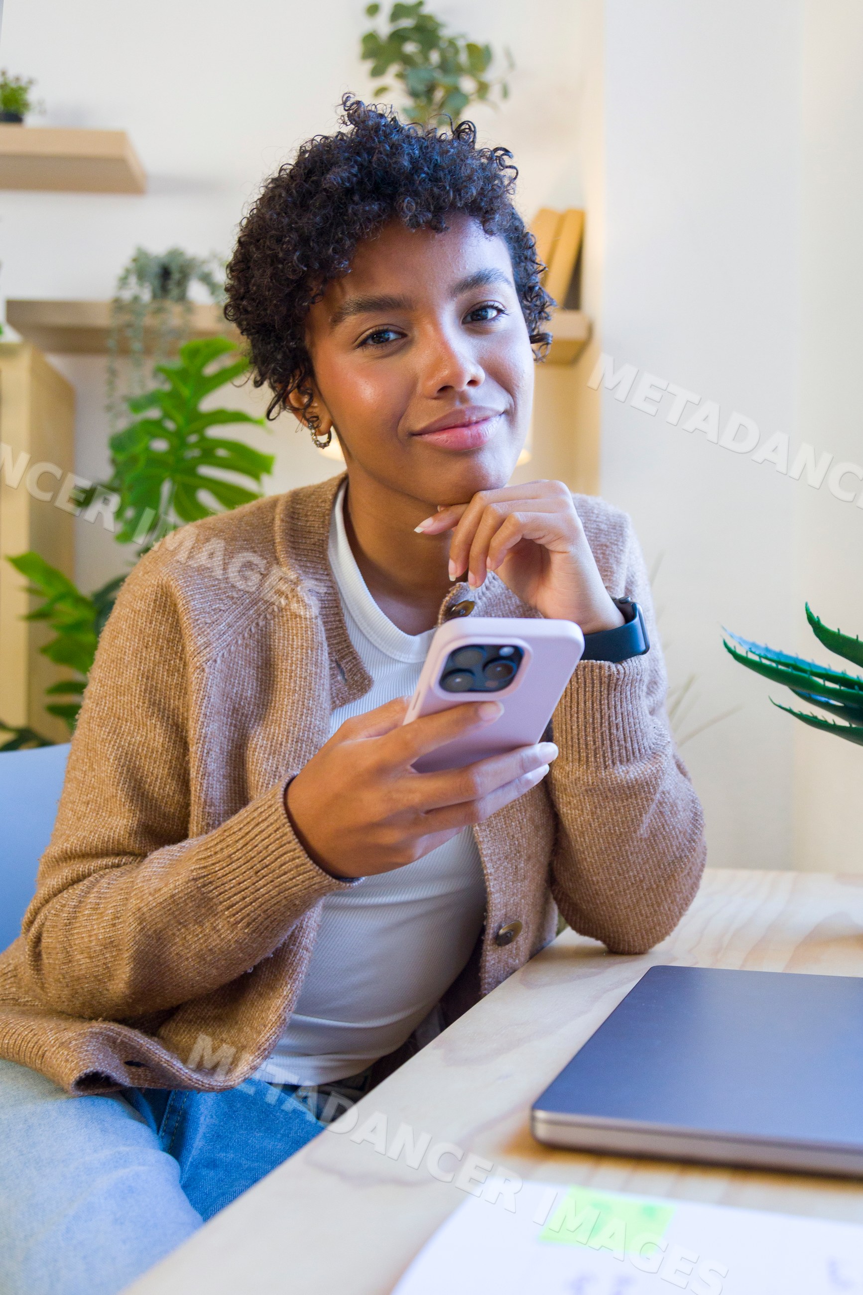 Young African American woman using smartphone