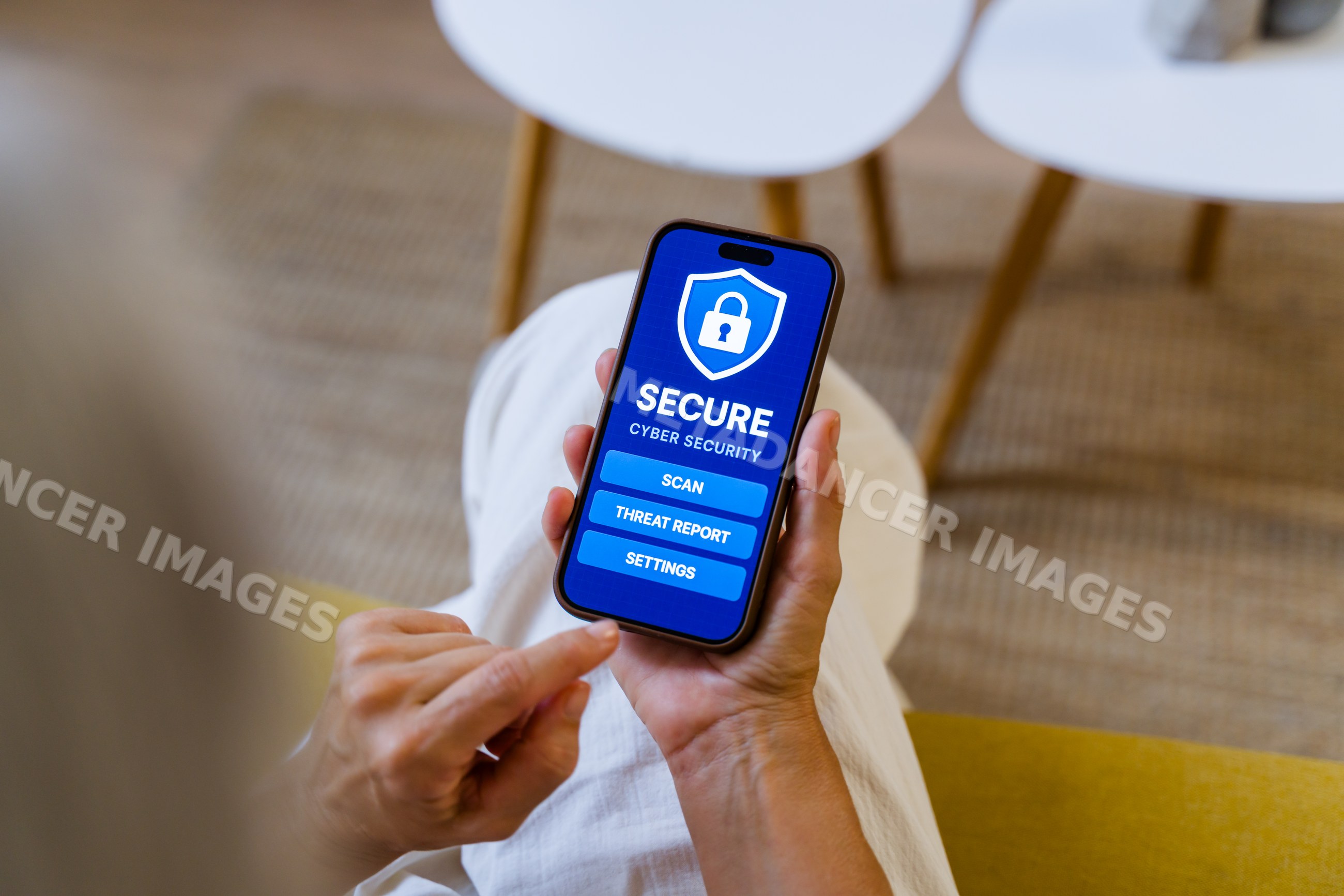 White person using cyber security app on smartphone indoors