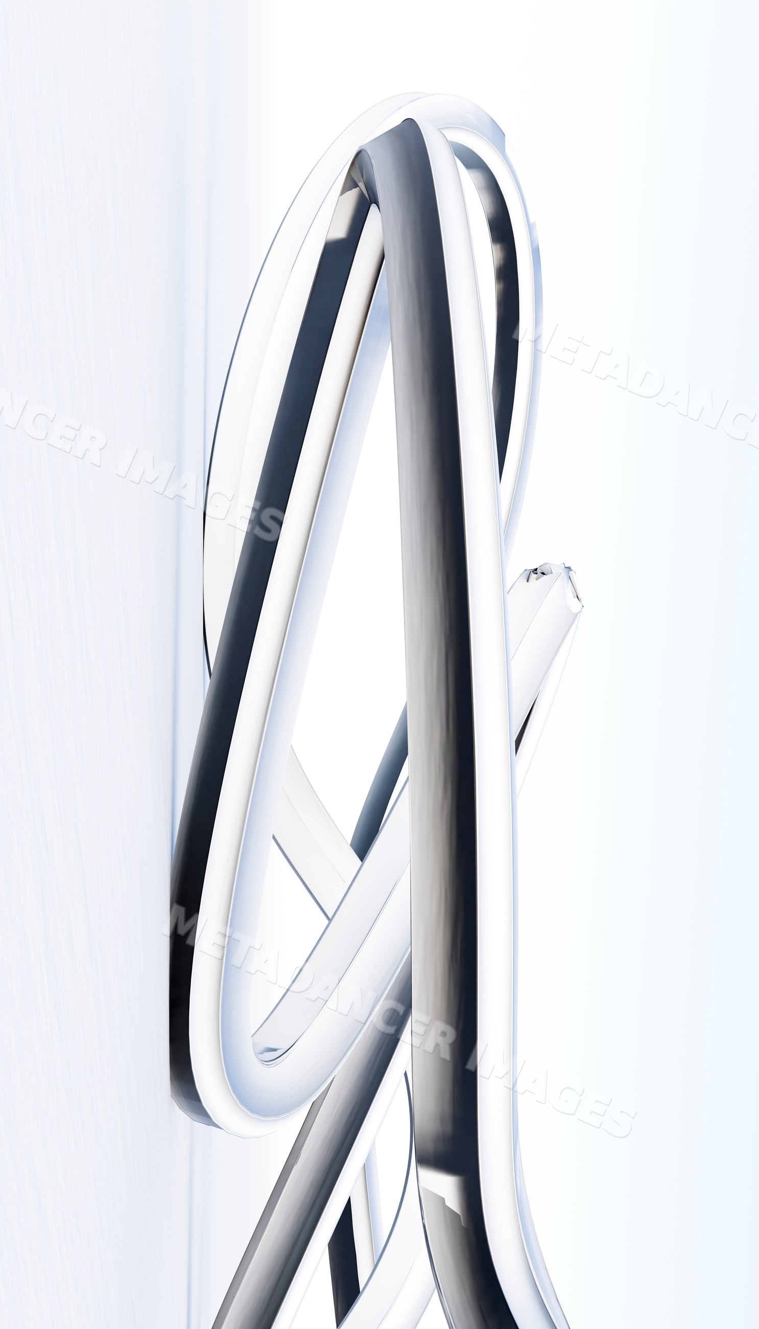 Abstract sculpture of intertwined curved metal tubes on white