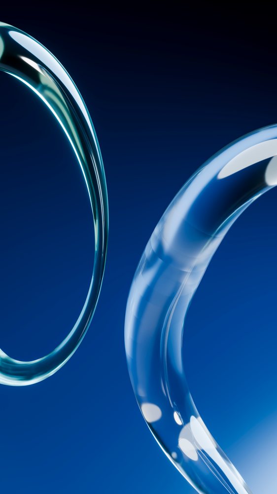 Abstract curved transparent glass shapes on blue background