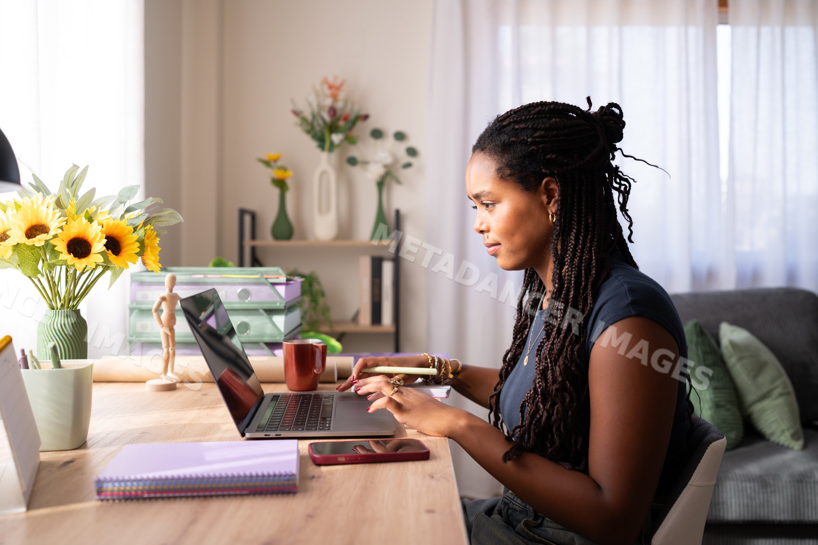 African American woman working remotely on a laptop
