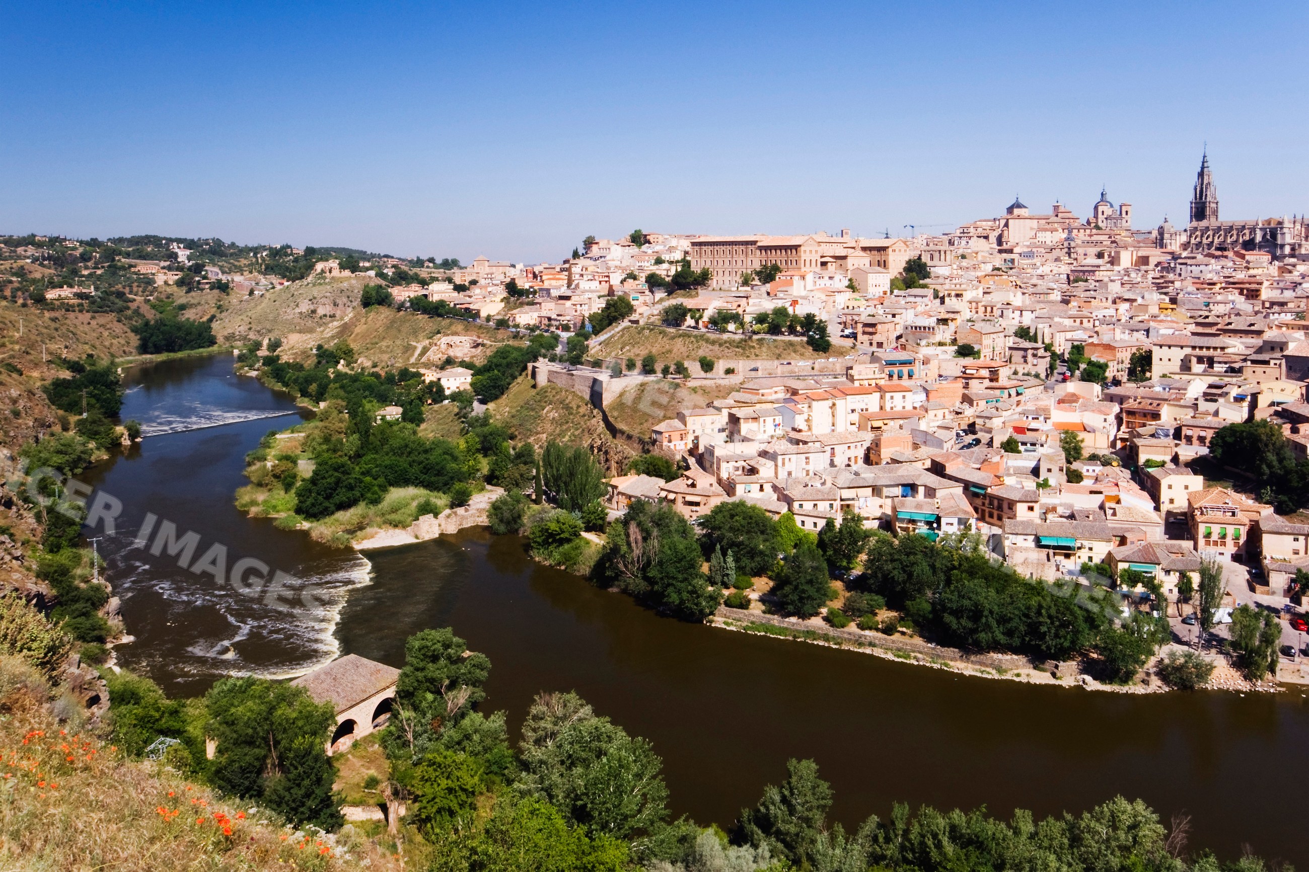 Toledo skyline with river and historic buildings