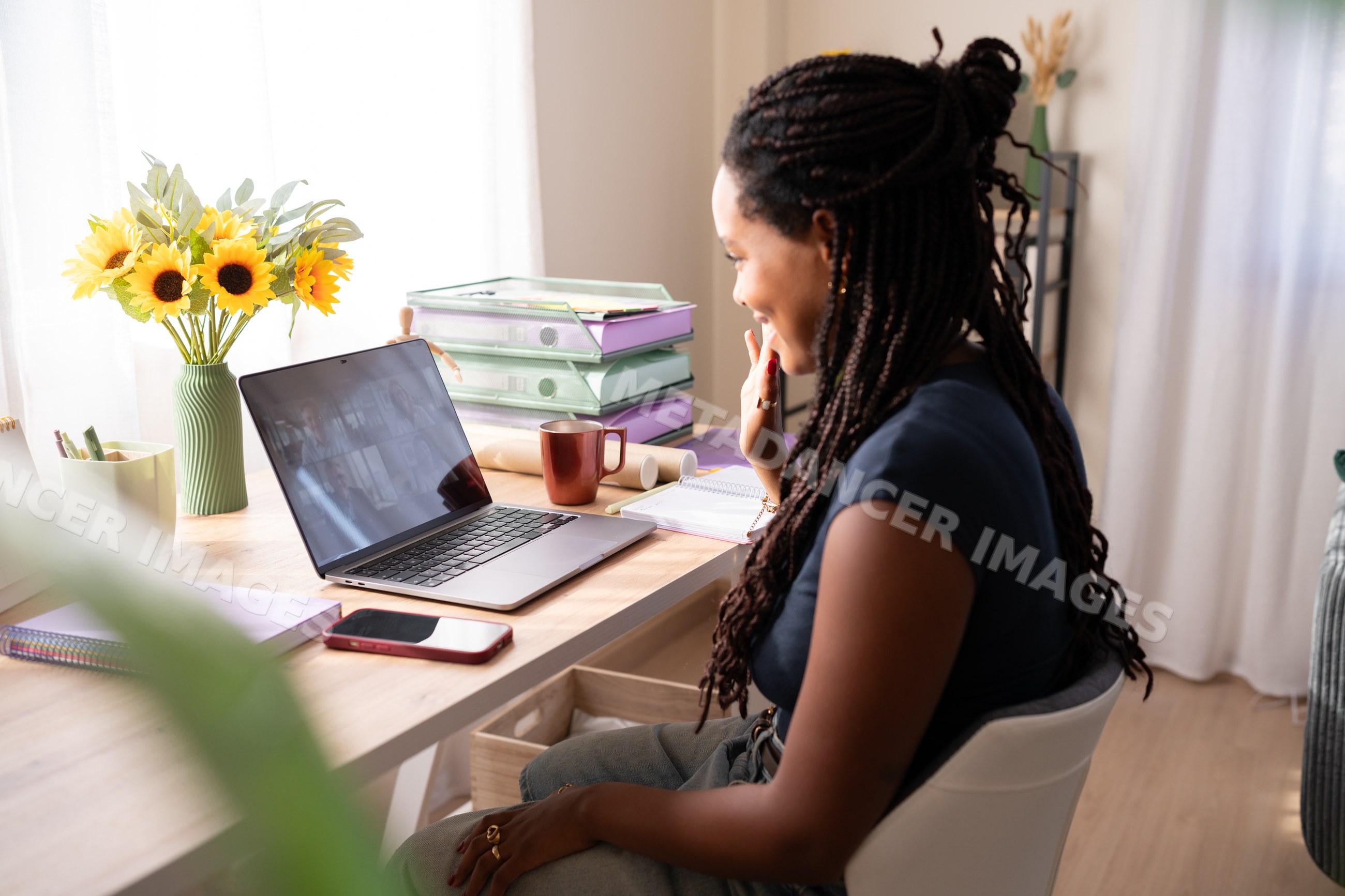 African American woman takes a video call