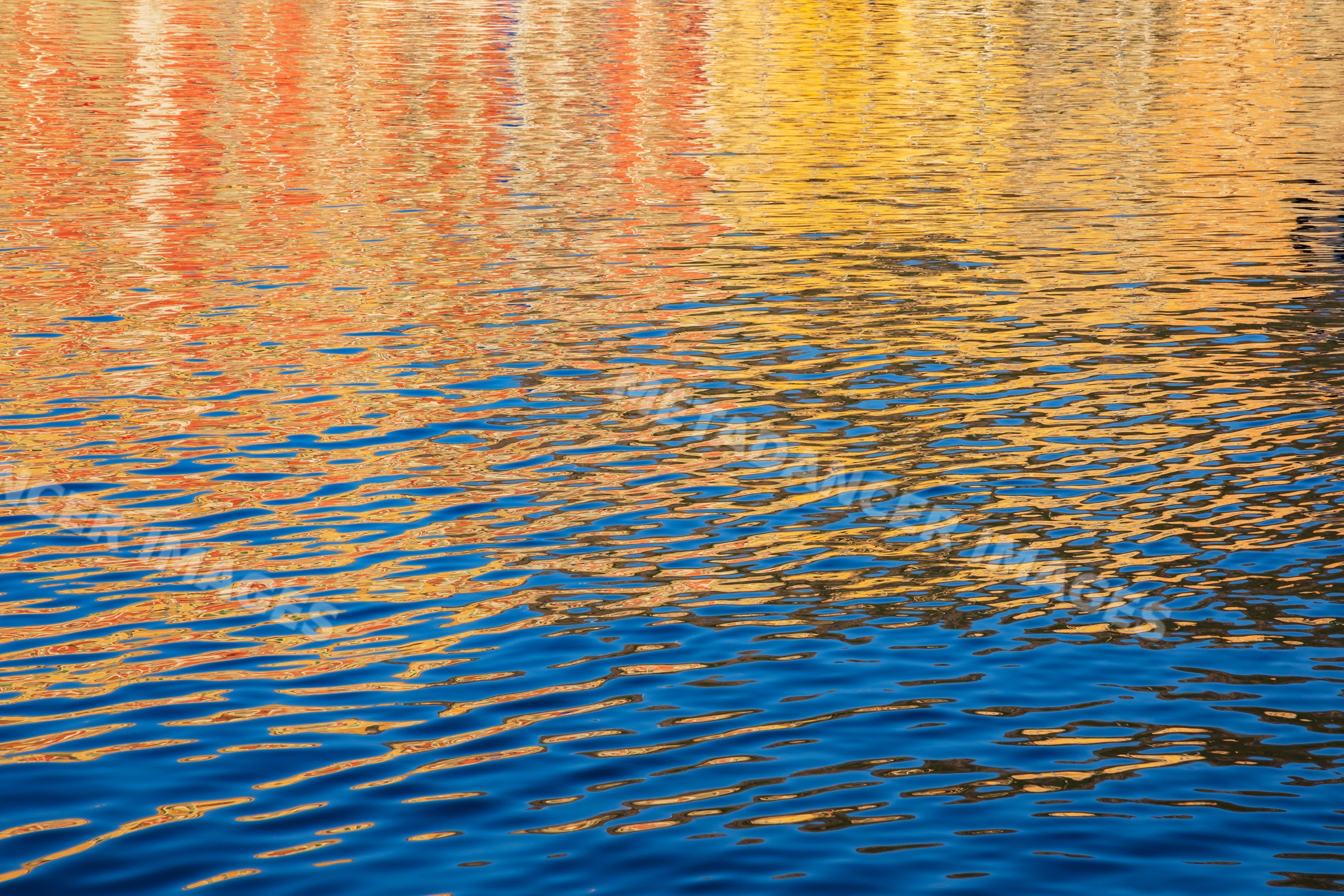Ripples and colorful reflections on water in bastia corsica