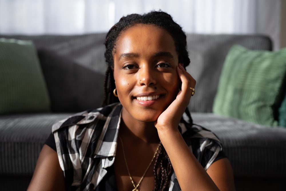 Young African American woman with braids smiling