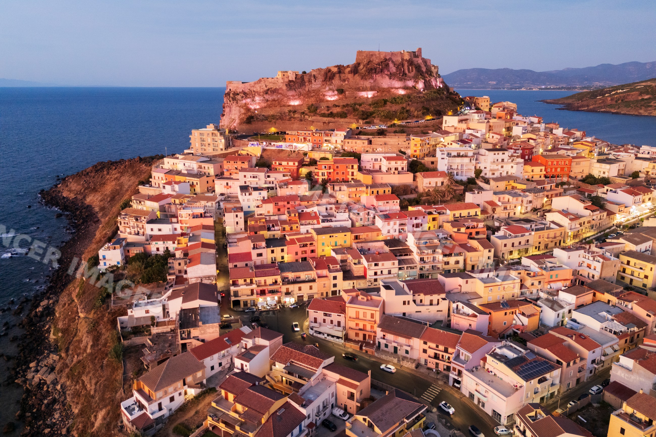 Castelsardo hilltop Citadel and coastal town at Dusk in sardinia