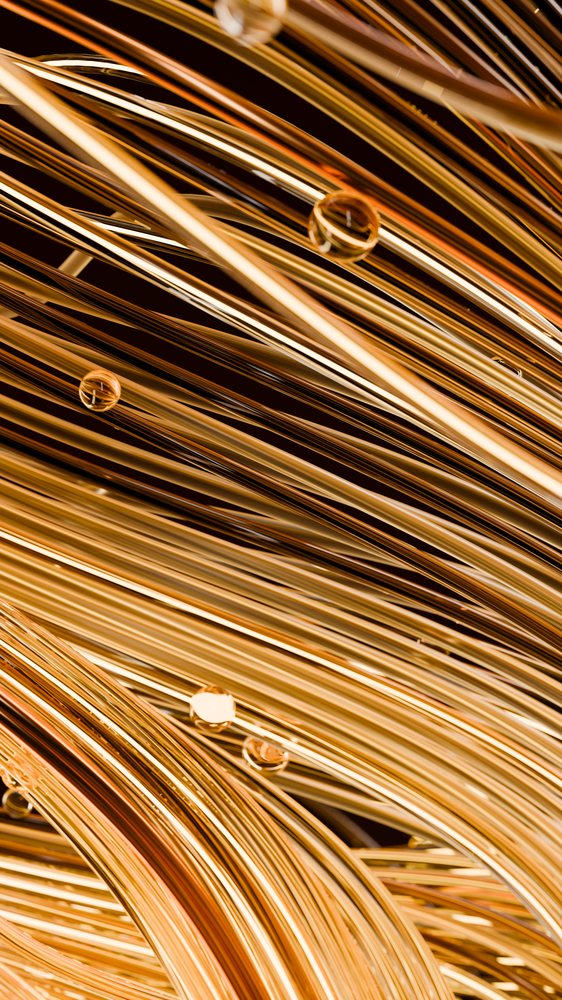 Close-up of shiny copper wires twisted into coils