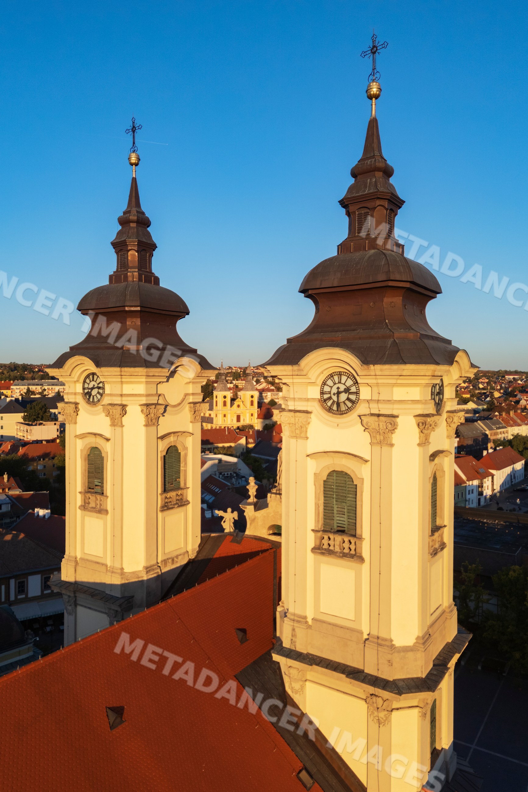 Minorite Church towers with clocks in eger, Hungary cityscape