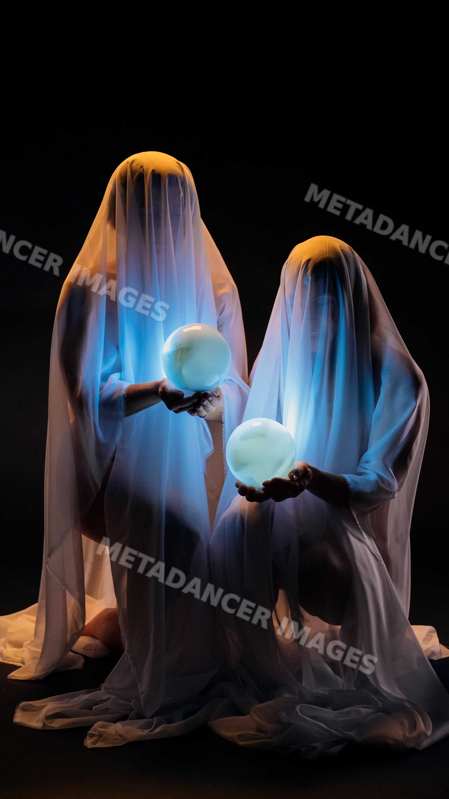 Two ghosts holding glowing crystal balls in a dark setting