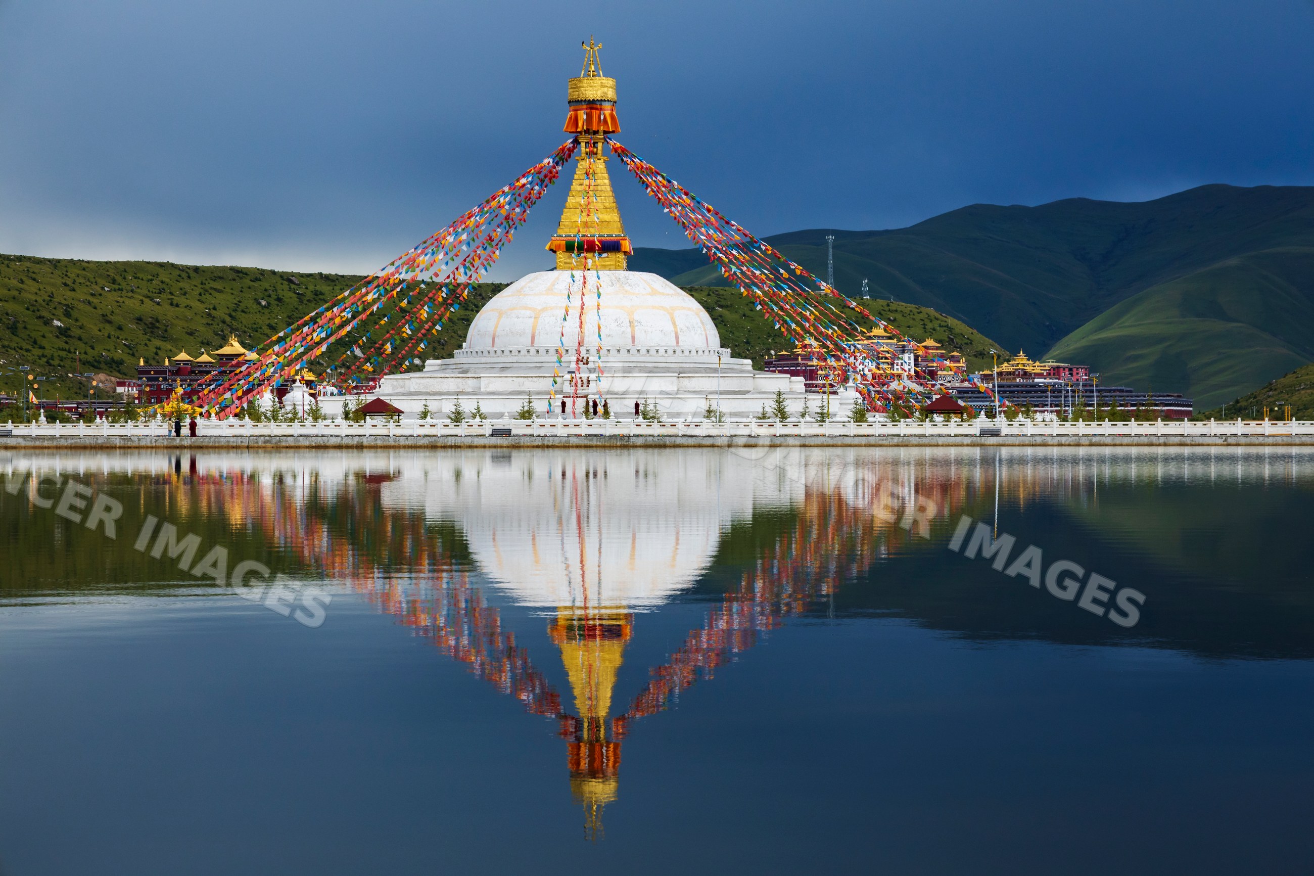 Stupa at the Zhuqing Wujian Zen Forest Monastery with lake reflection