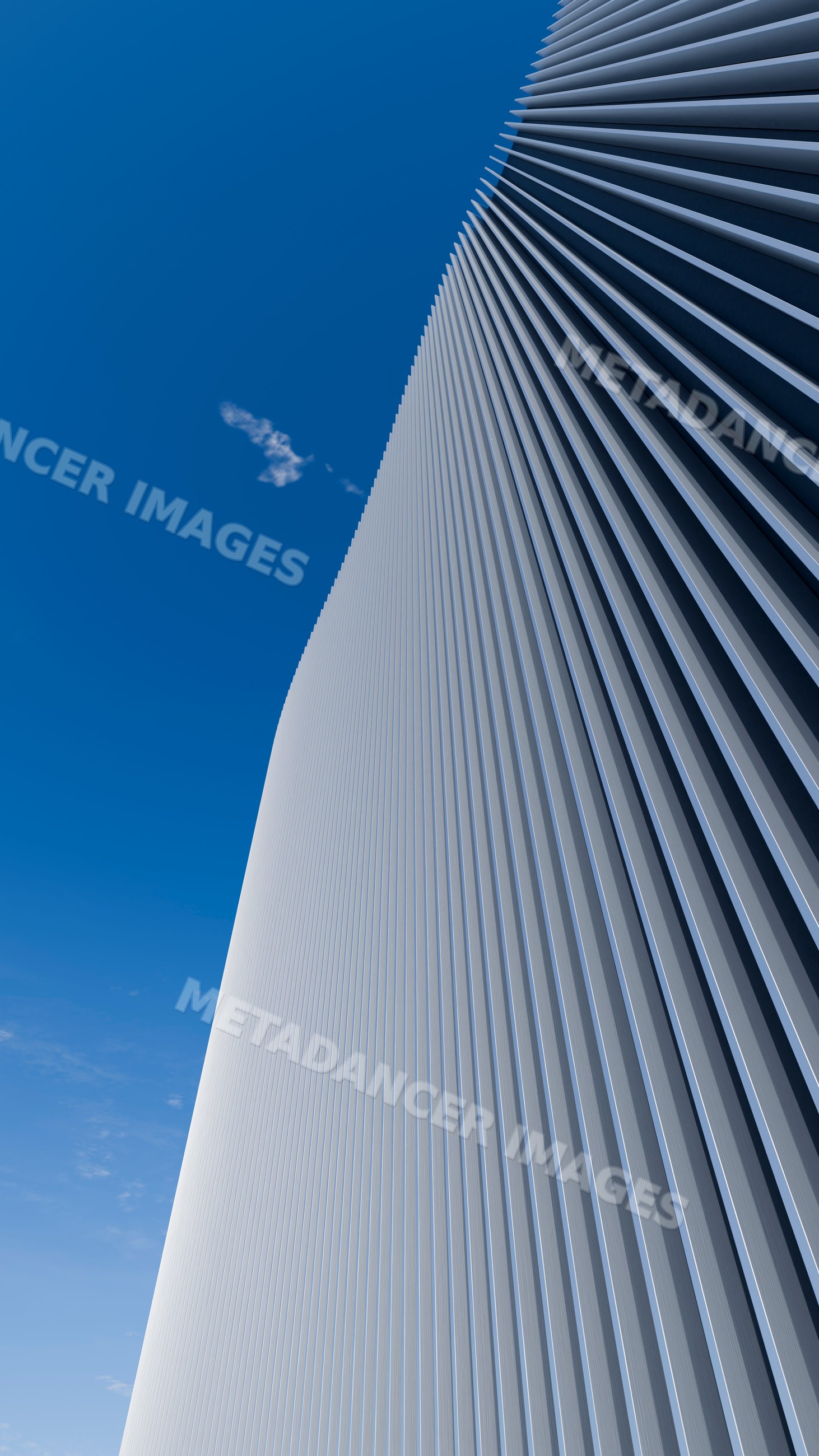 Modern building facade with vertical metal siding and clear blue sky