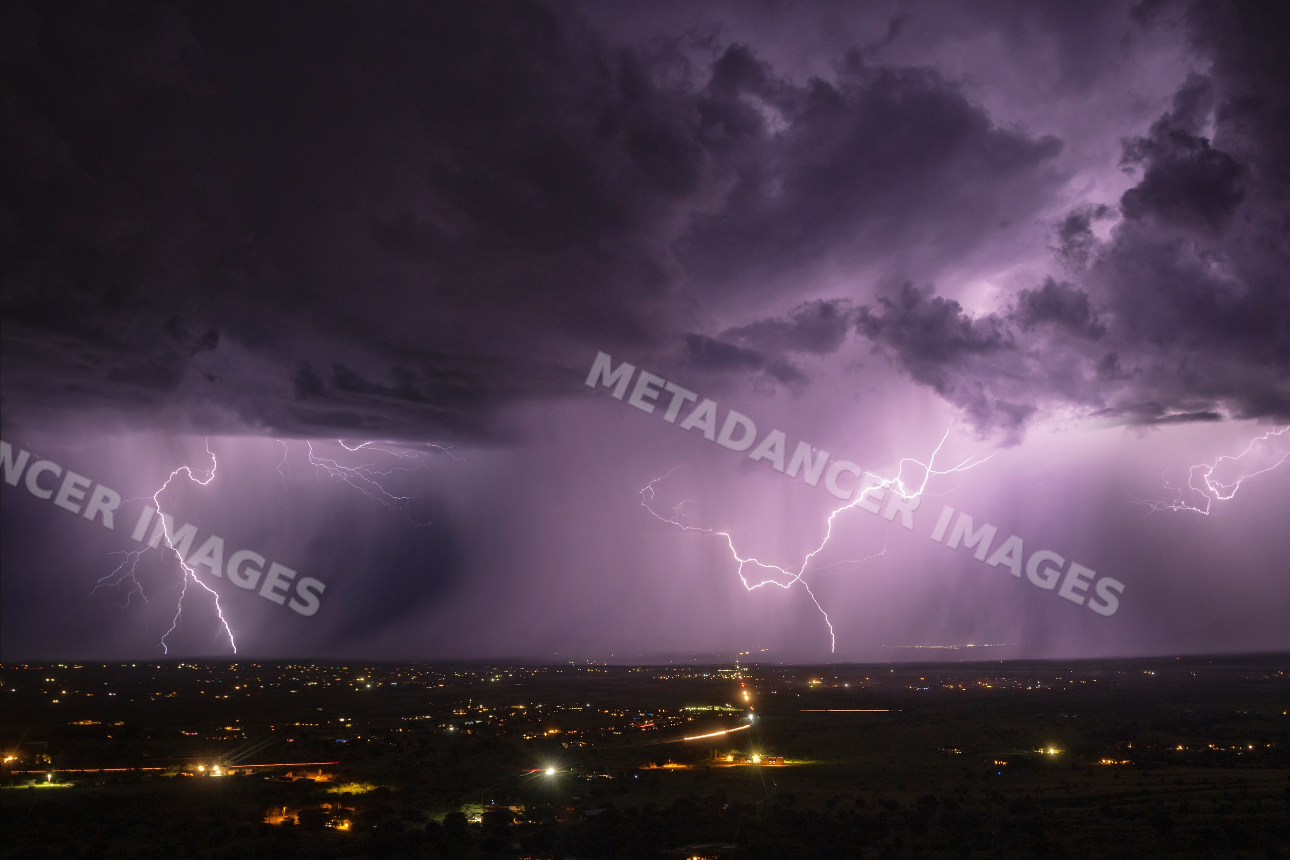 Lightning striking over sierra vista under stormy skies at night