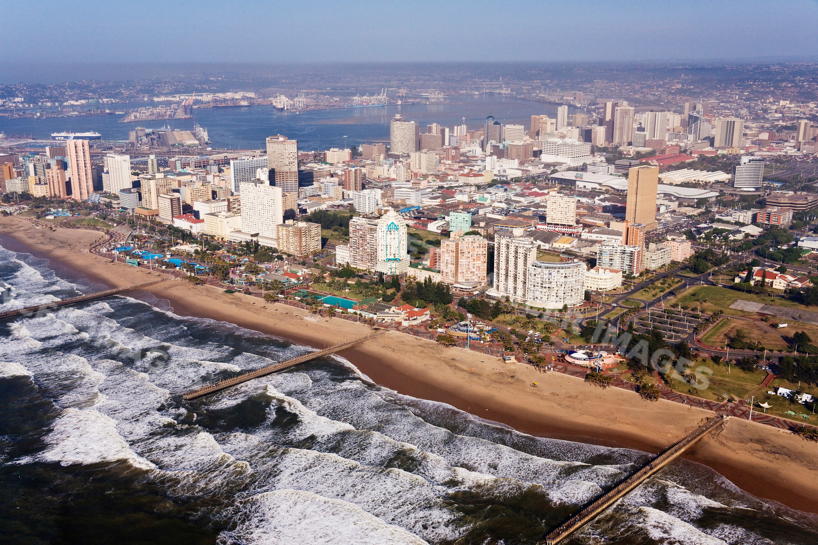 Golden mile beachfront with piers and city skyline south africa