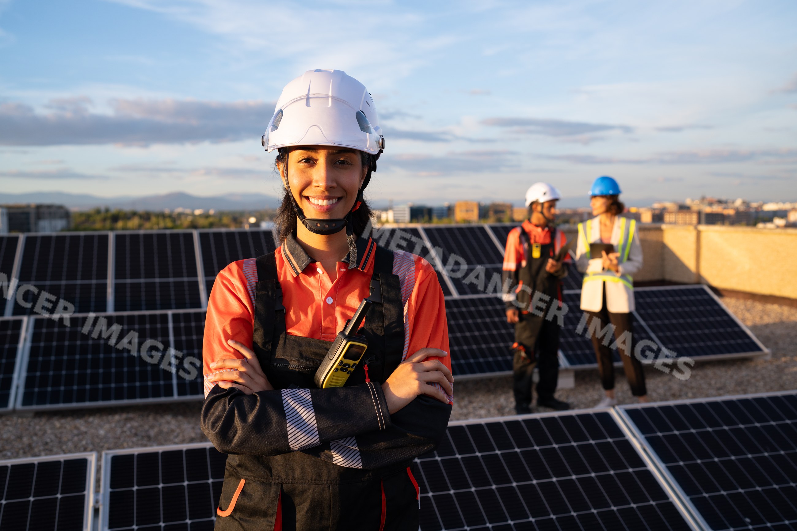 Hispanic and white woman worker standing with solar panels