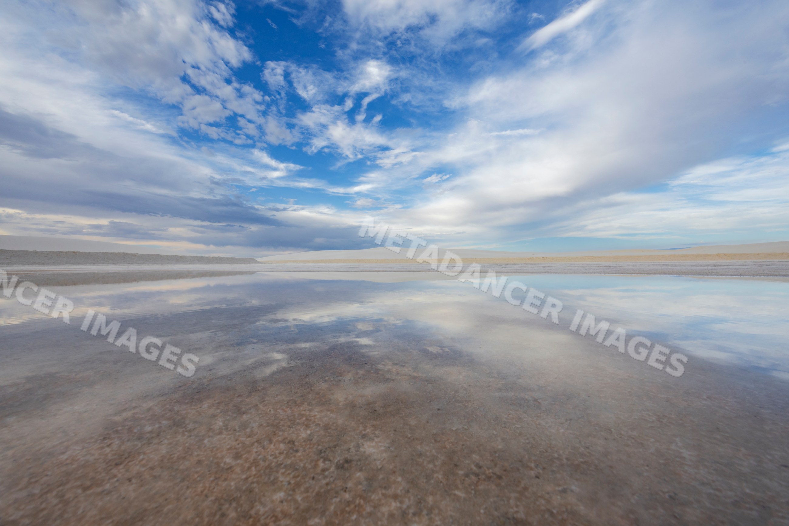 Desert landscape with sky reflection at white sands national park