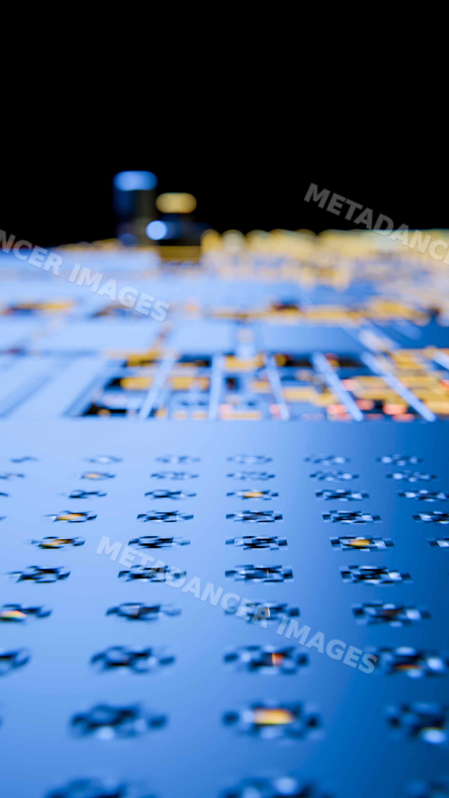 Close-up of blue circuit board with electronic components