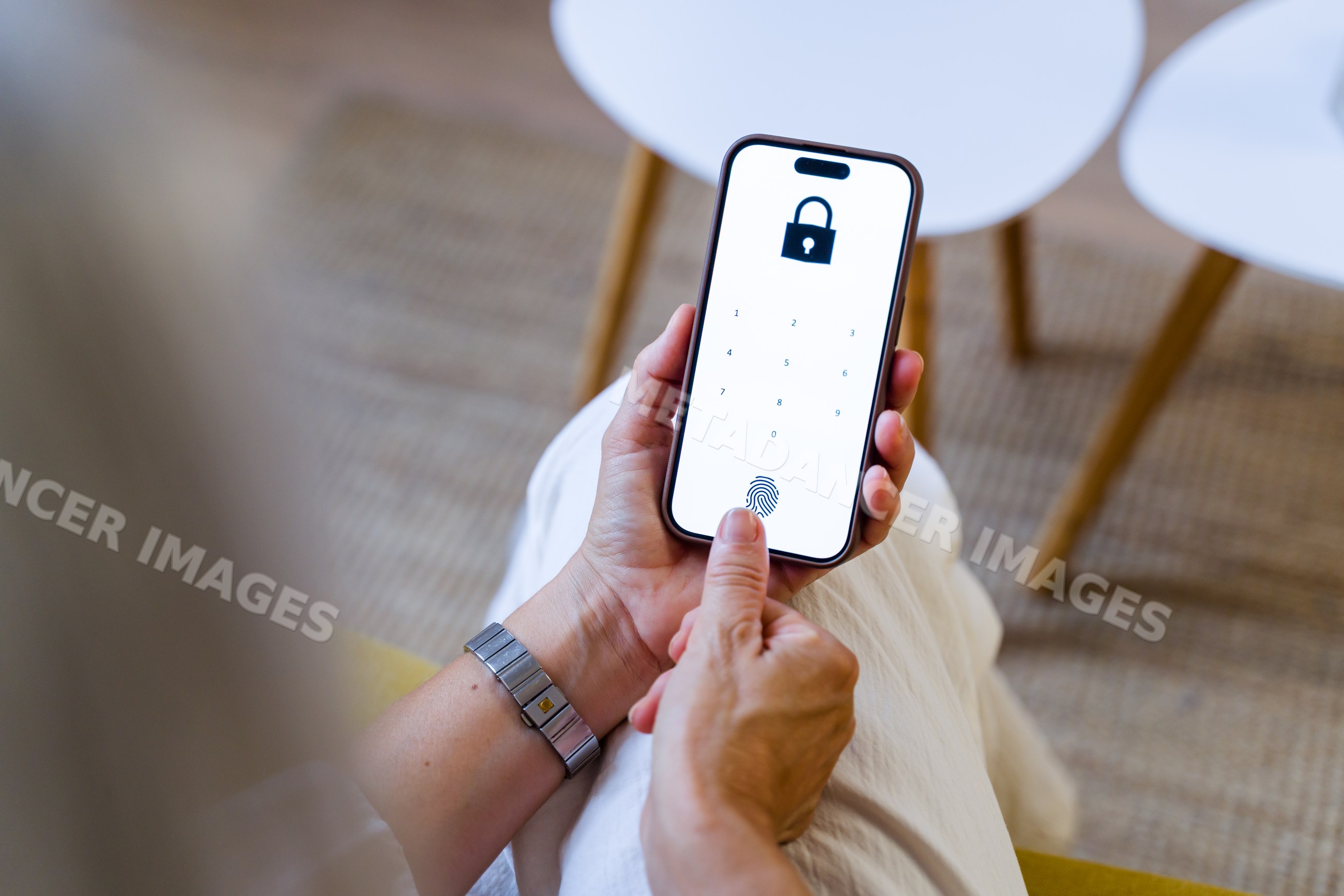 White person unlocking smartphone using fingerprint on lock screen