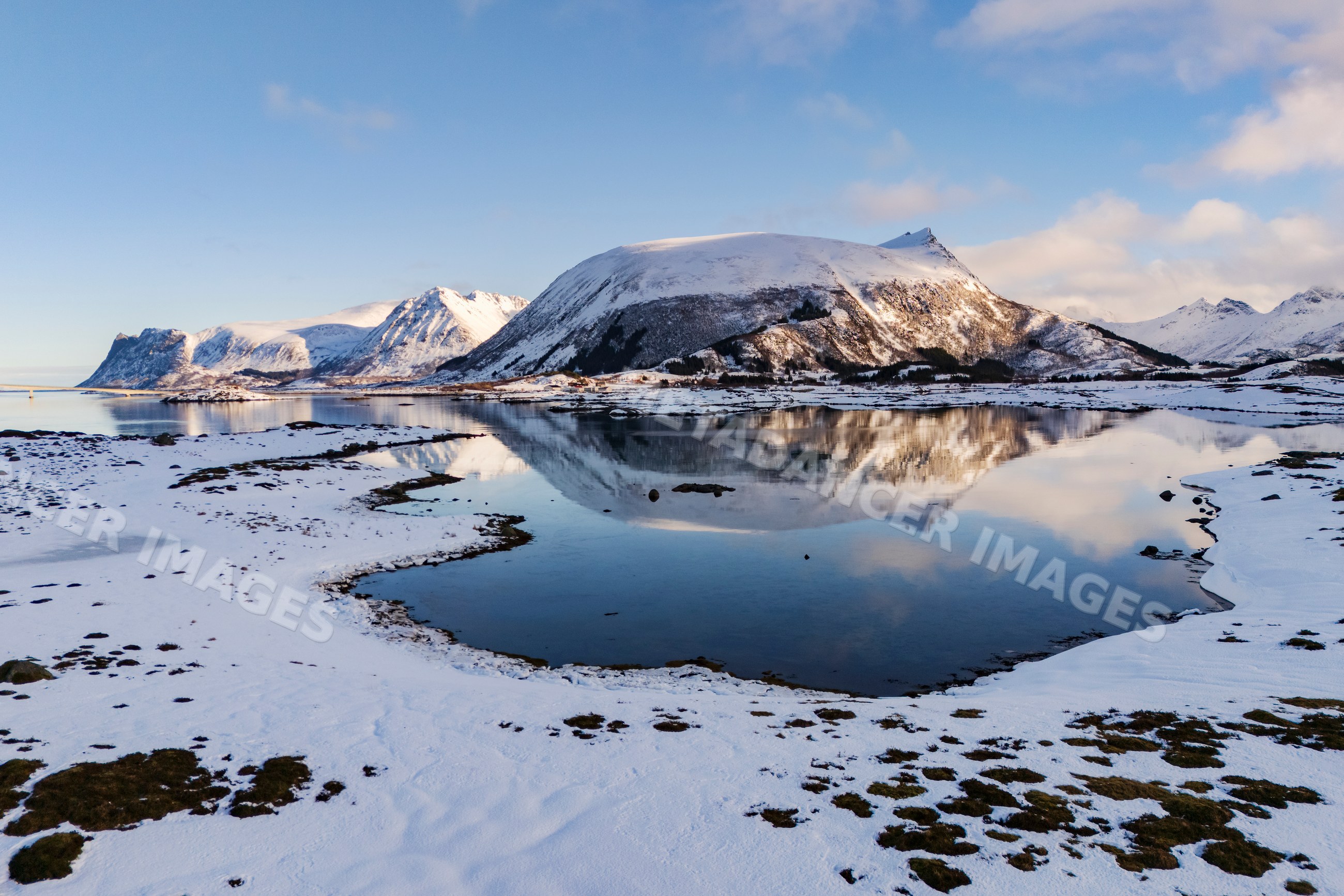 Arctic Norway landscape with snow-capped mountains and fjord