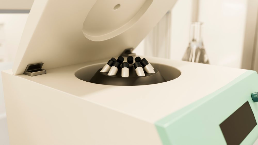 Laboratory centrifuge with capped test tubes for sample processing