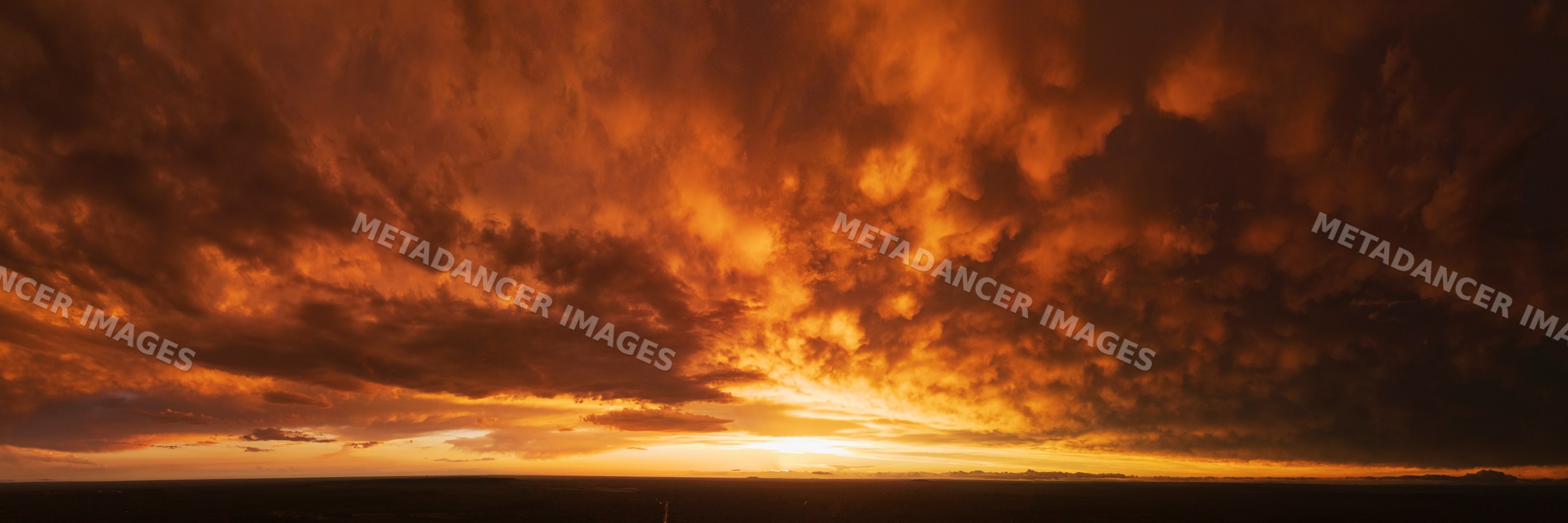 Sunset with dramatic storm clouds over Uvalde landscape