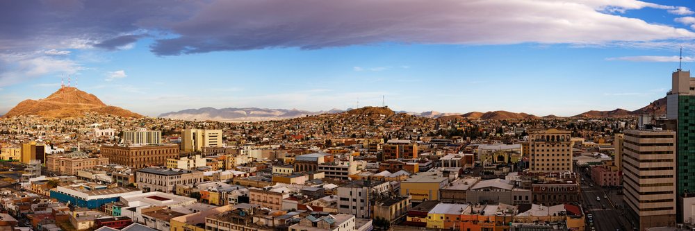 Panoramic cityscape view of chihuahua with mountains and buildings