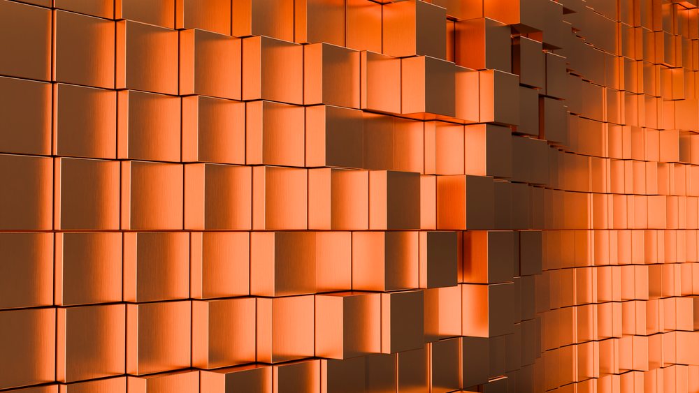 Abstract orange metallic cube wall with geometric 3d pattern