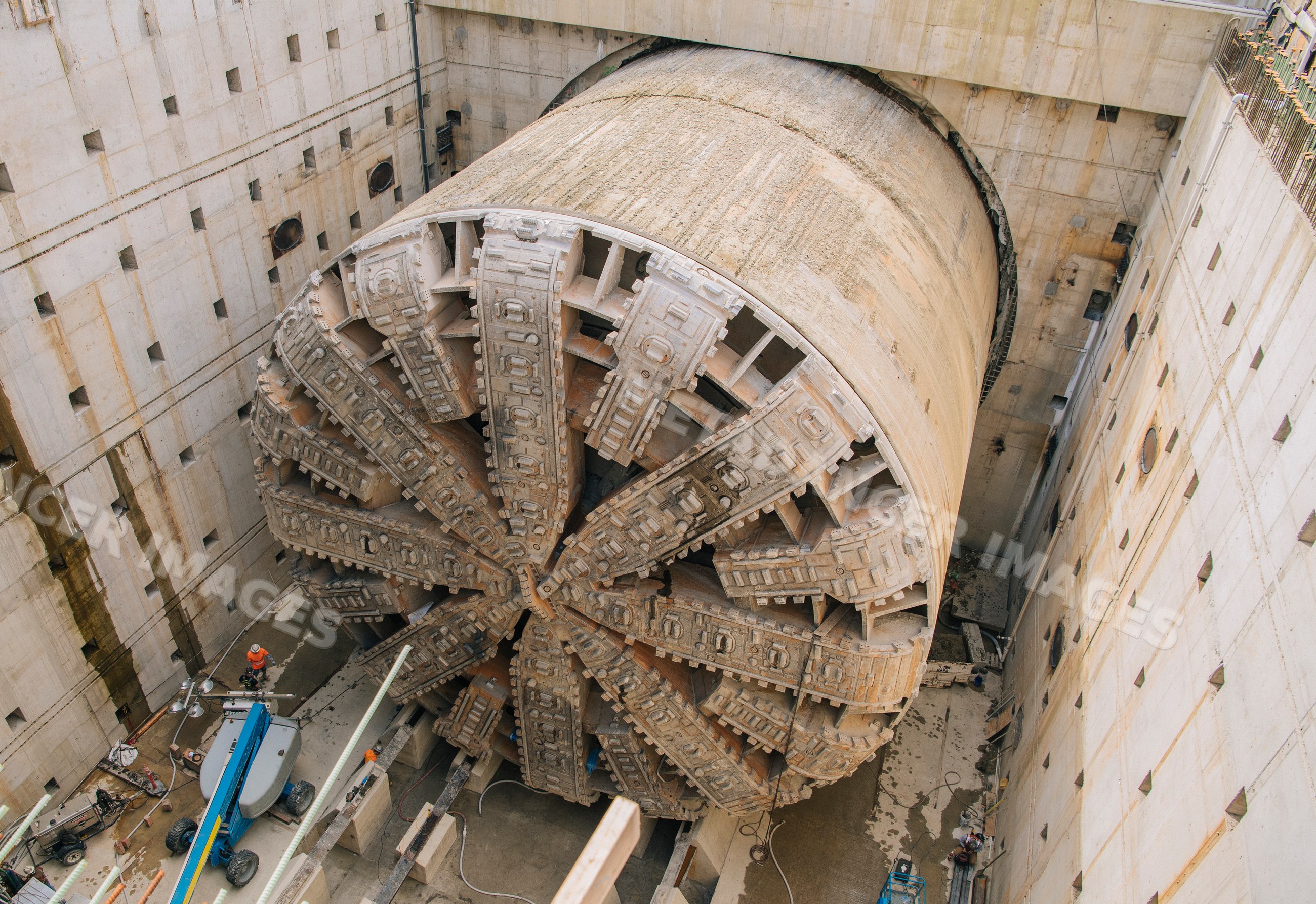 A massive tunnel boring machine prepares for underground drilling