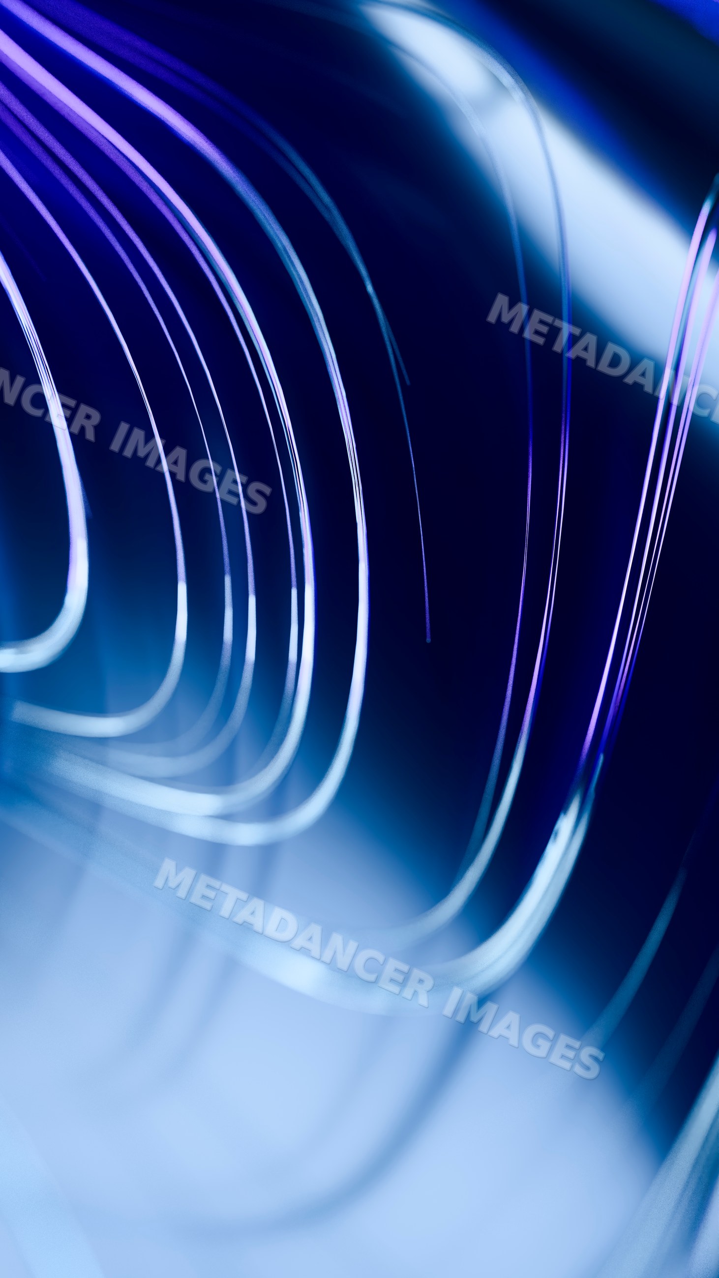Curved abstract glass elements with blue light and reflections